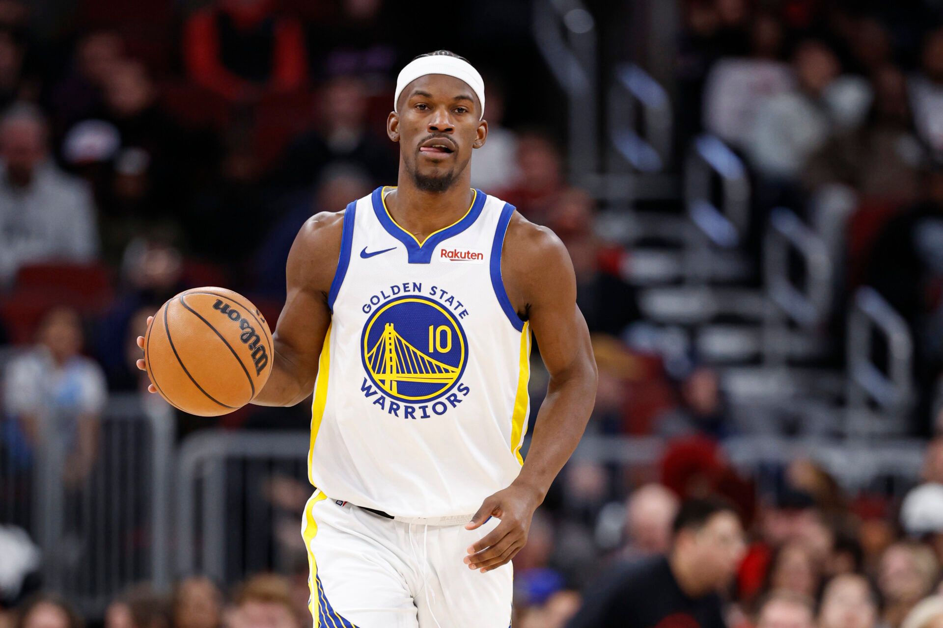Golden State Warriors forward Jimmy Butler III (10) brings the ball up court against the Chicago Bulls during the second half at United Center.