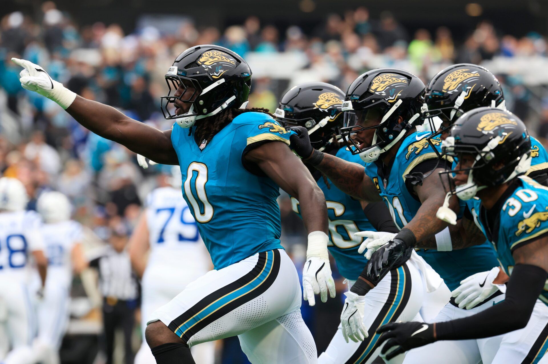 Jacksonville Jaguars linebacker Devin Lloyd (0) reacts to his interception during the first quarter of an NFL football game at EverBank Stadium, Sunday, Dec. 7, 2025, in Jacksonville, Fla. [Corey Perrine/Florida Times-Union]
