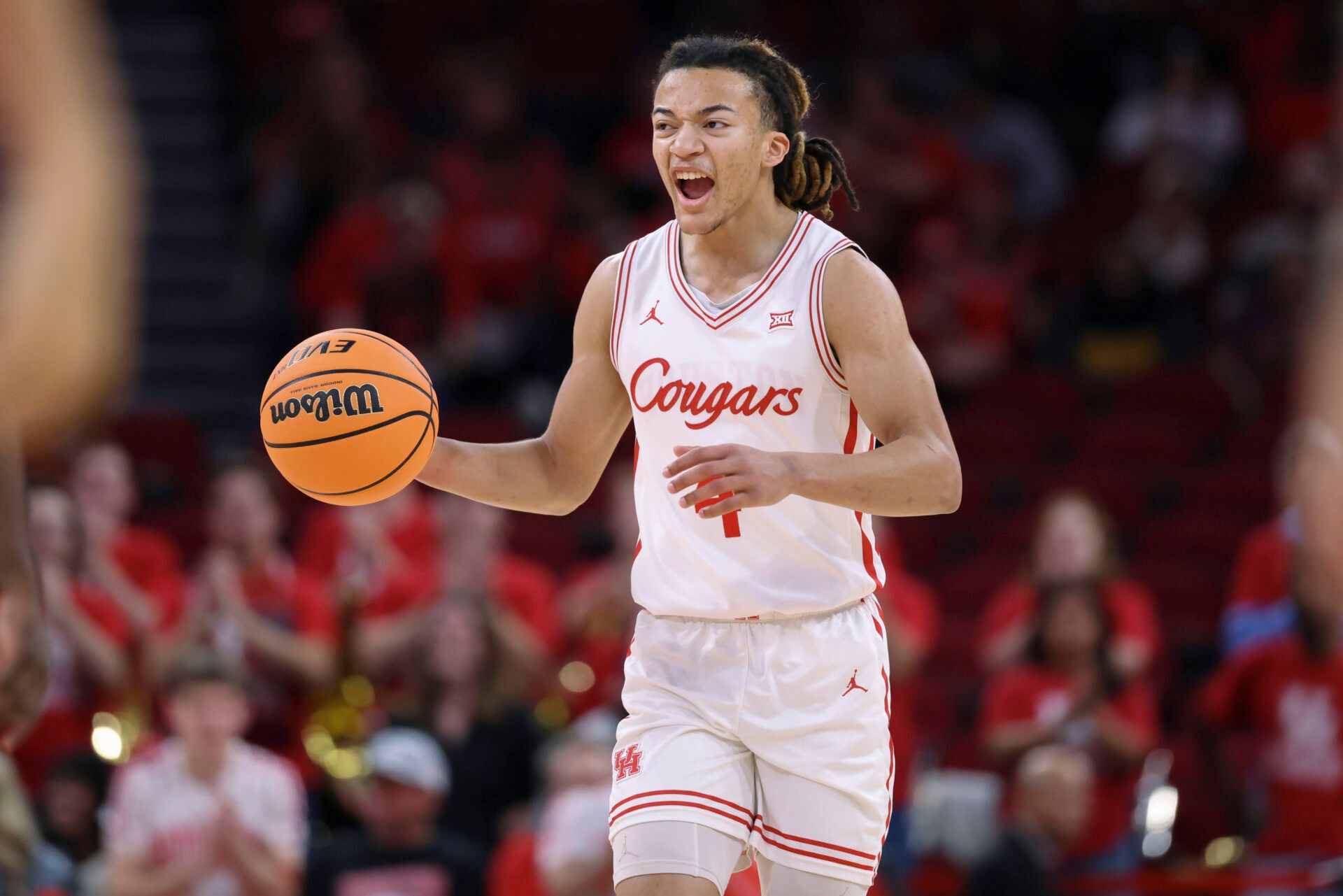 Houston Cougars guard Kingston Flemings (4) dribbles the ball during the first half against the Florida State Seminoles at Toyota Center.