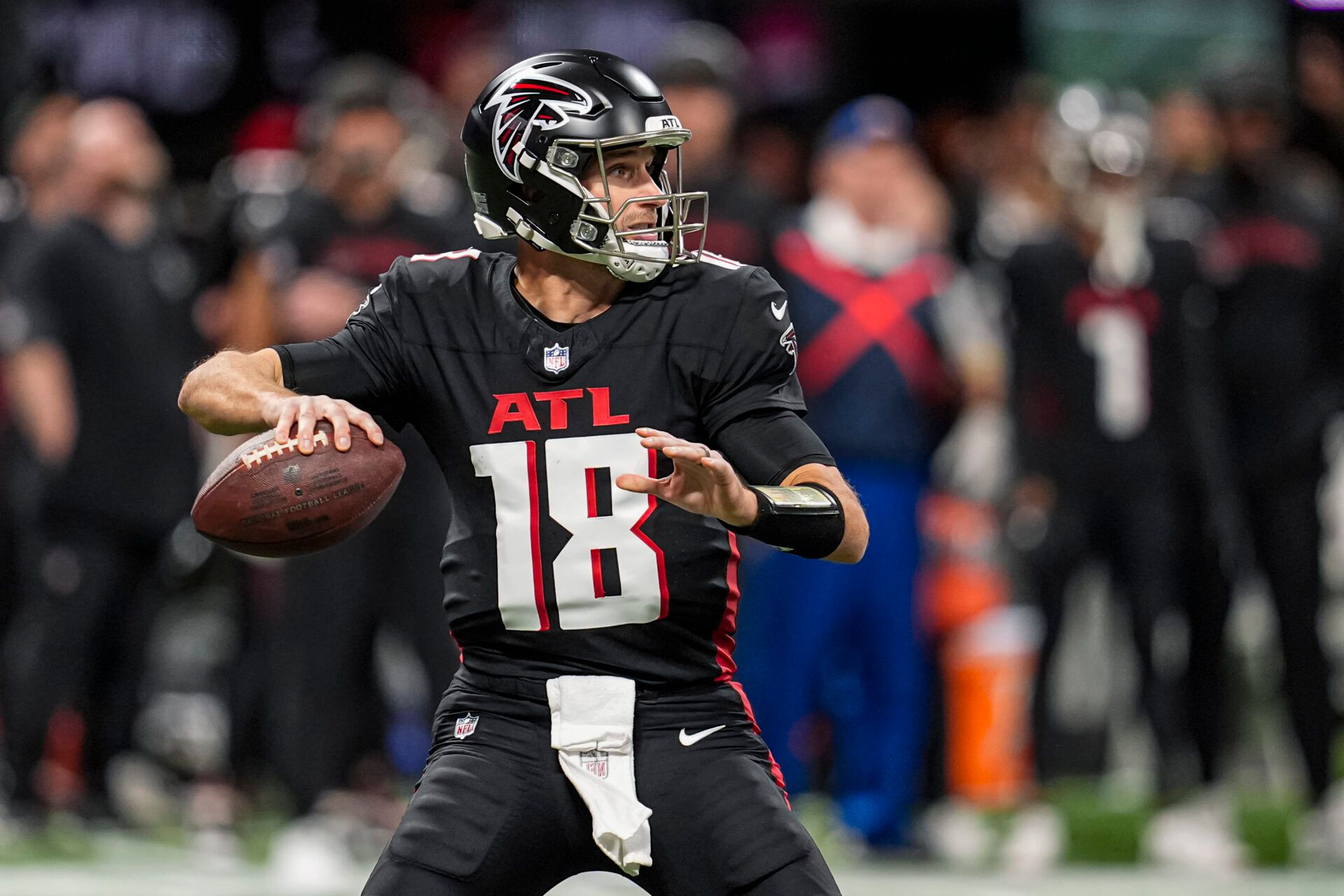 Atlanta Falcons quarterback Kirk Cousins (18) passes the ball against the Seattle Seahawks during the first half at Mercedes-Benz Stadium.