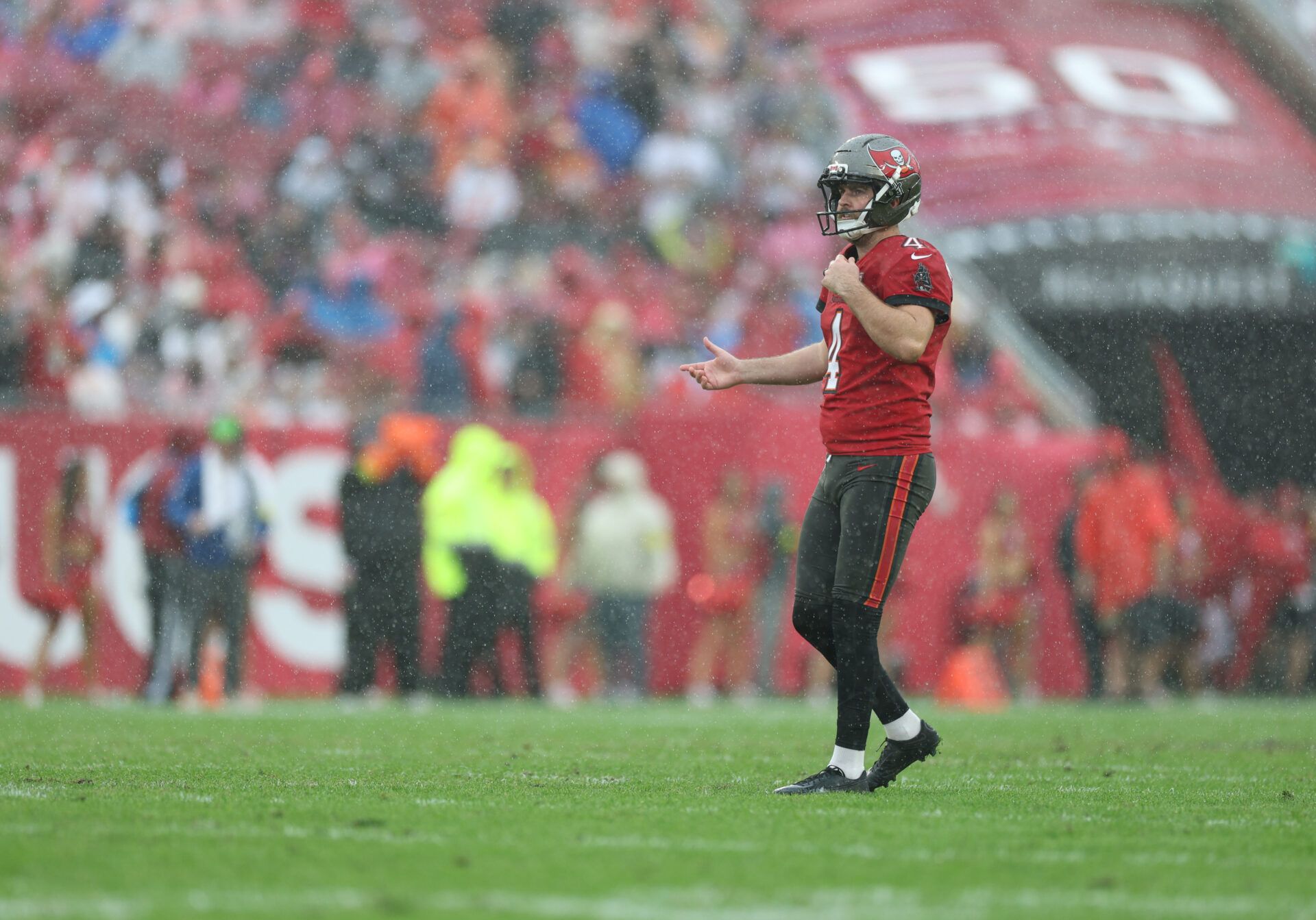 Tampa Bay Buccaneers quarterback Baker Mayfield (6) reacts to a play during the second quarter against the New Orleans Saints in the rain at at Raymond James Stadium.