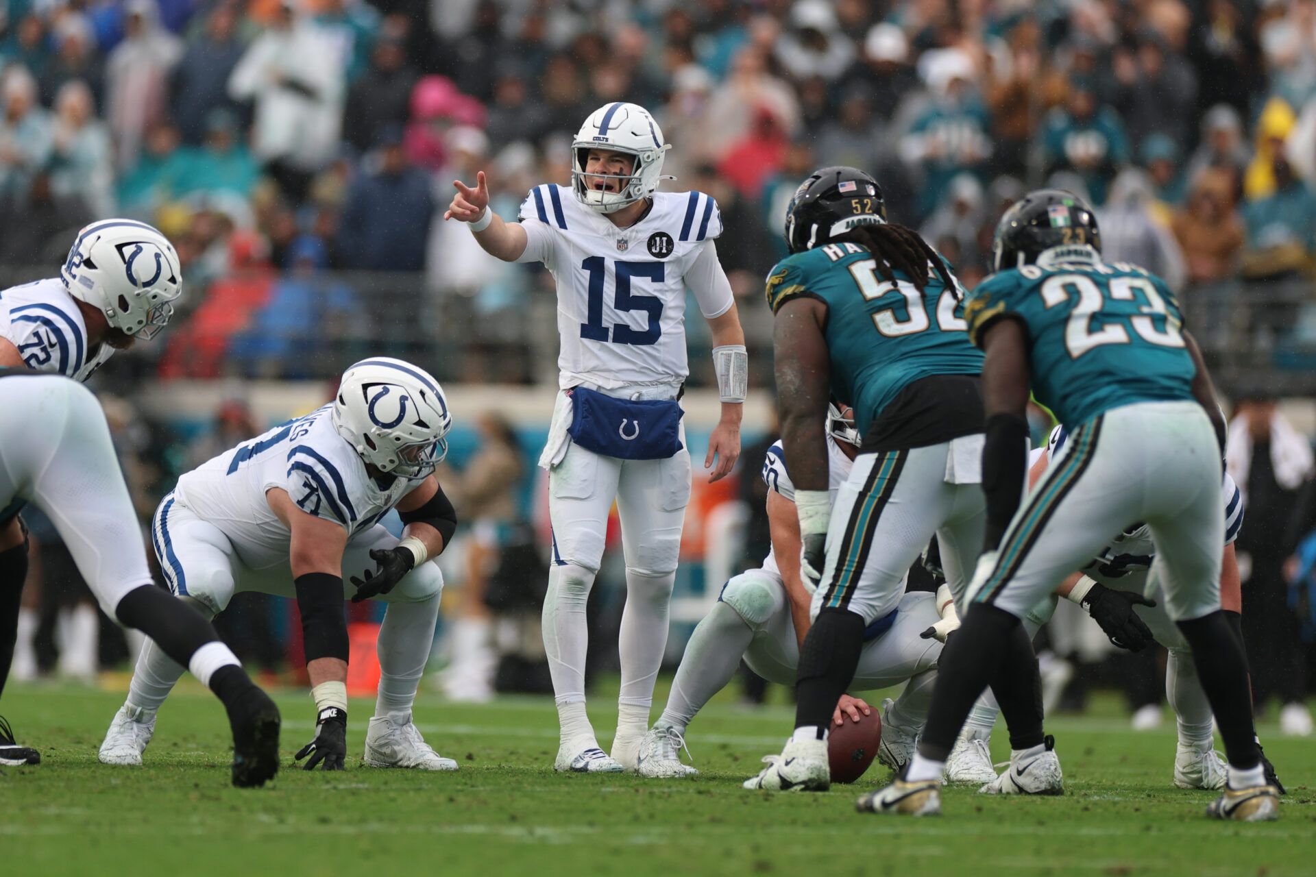 Indianapolis Colts quarterback Riley Leonard (15) calls out a play at the line of scrimmage against the Jacksonville Jaguars during the first half at EverBank Stadium.