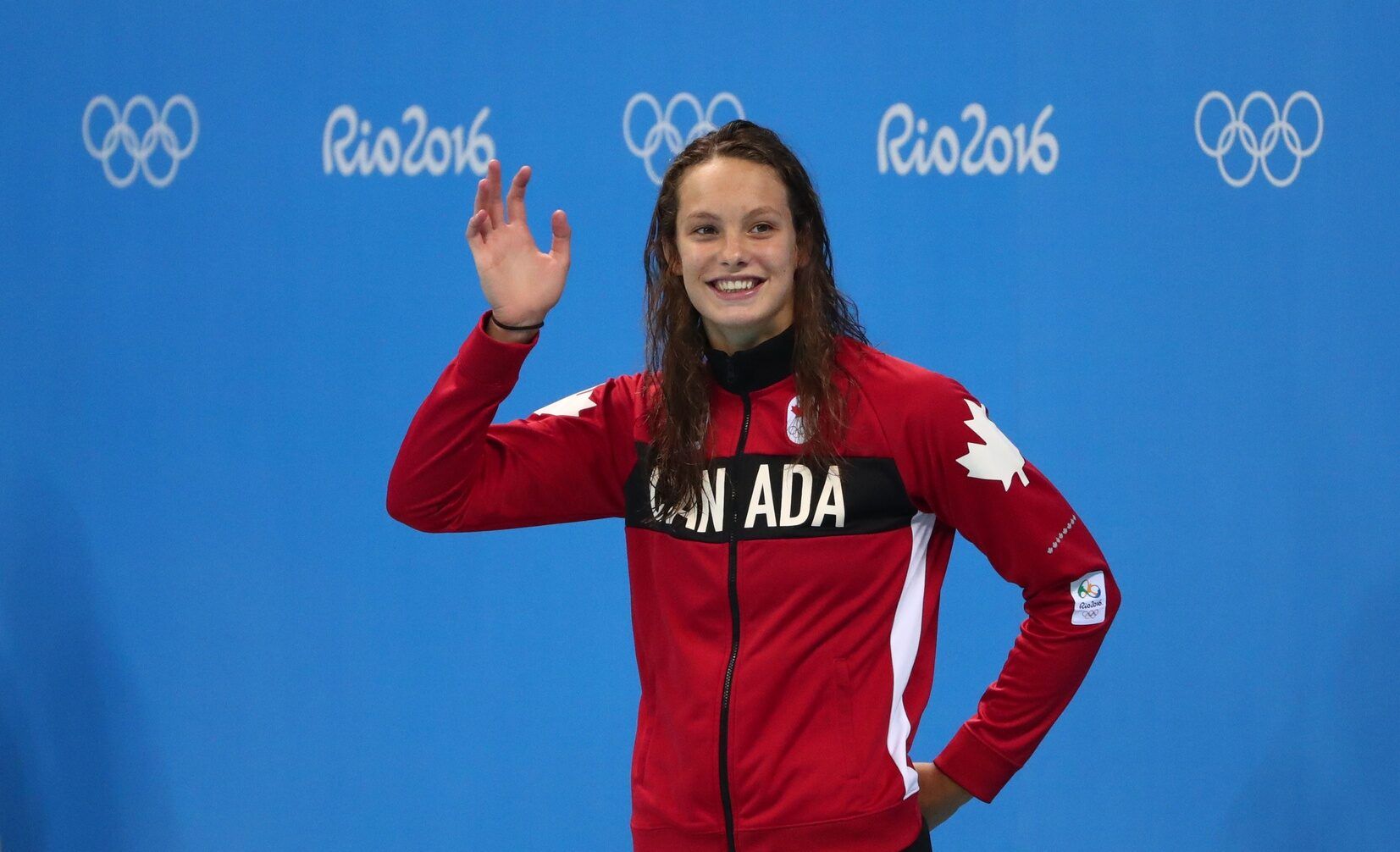 Penny Oleksiak (CAN) on the podium after the women's 100m butterfly final in the Rio 2016 Summer Olympic Games at Olympic Aquatics Stadium.