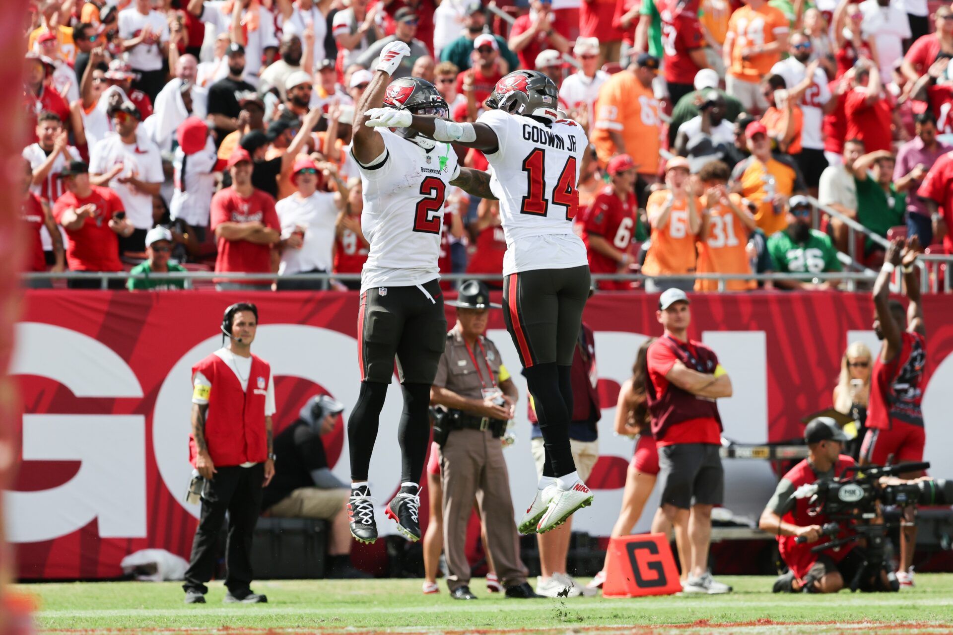 Tampa Bay Buccaneers wide receiver Emeka Egbuka (2) celebrates with wide receiver Chris Godwin Jr. (14) during the second half against the Philadelphia Eagles  at Raymond James Stadium.