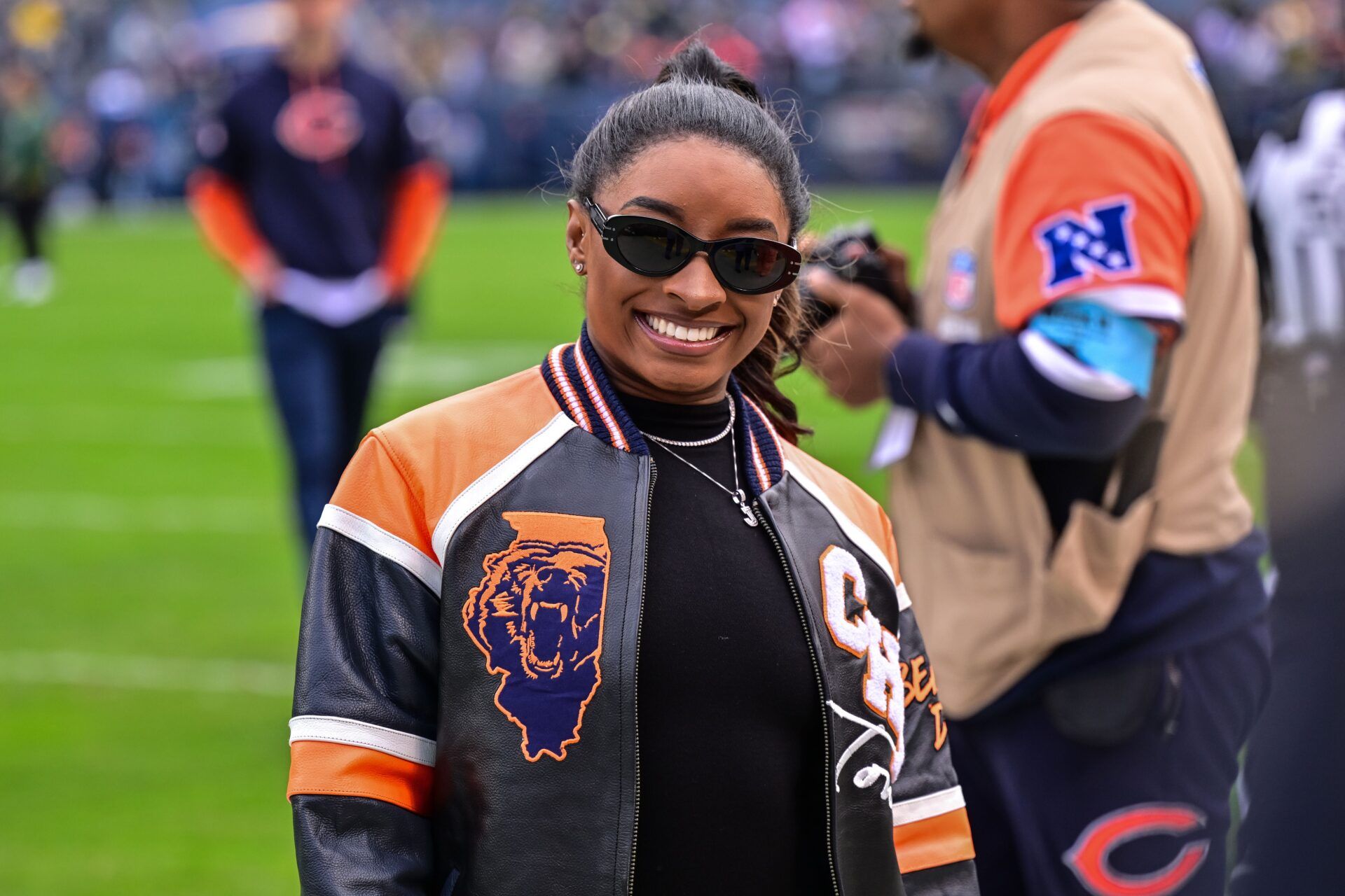 United States gymnast Simone Biles poses for a photo before the game between the Chicago Bears and Green Bay Packers at Soldier Field.
