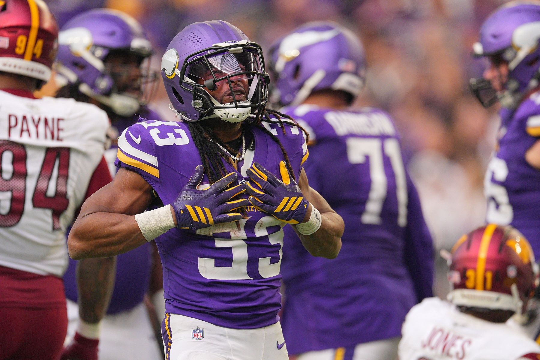 Minnesota Vikings running back Aaron Jones (33) reacts against the Washington Commanders during the second half at U.S. Bank Stadium.