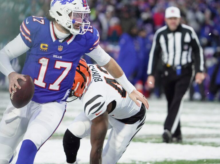 Buffalo Bills quarterback Josh Allen gets past Cincinnati Bengals linebacker Oren Burks and throws a pass during second half action at Highmark Stadium in Orchard Park on Dec. 7, 2025. The pass ended up being caught out of bounds for an incompletion.