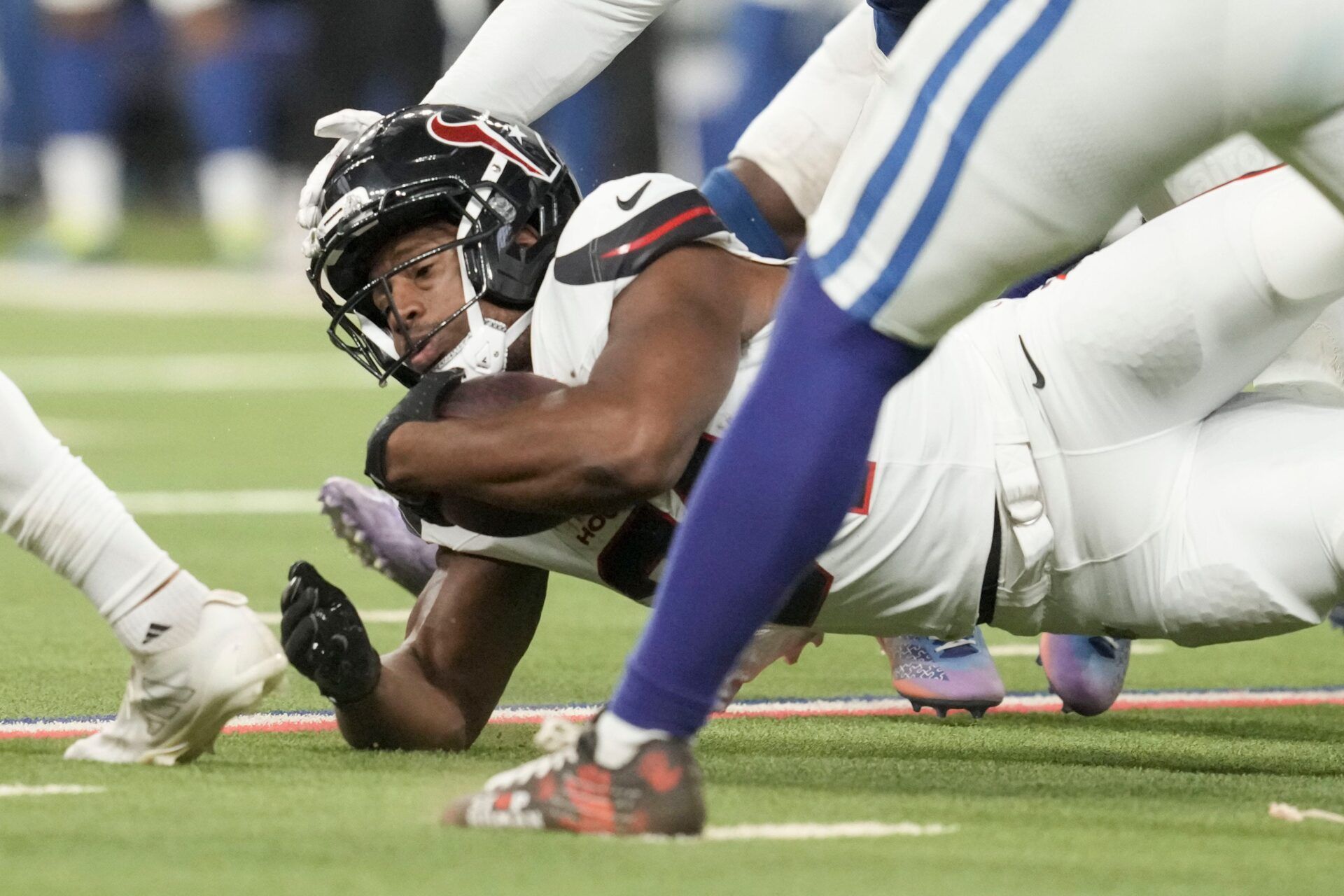 Houston Texans running back Nick Chubb (21) hits the turf Sunday, Nov. 30, 2025, during a game against the Houston Texans at Lucas Oil Stadium in Indianapolis.