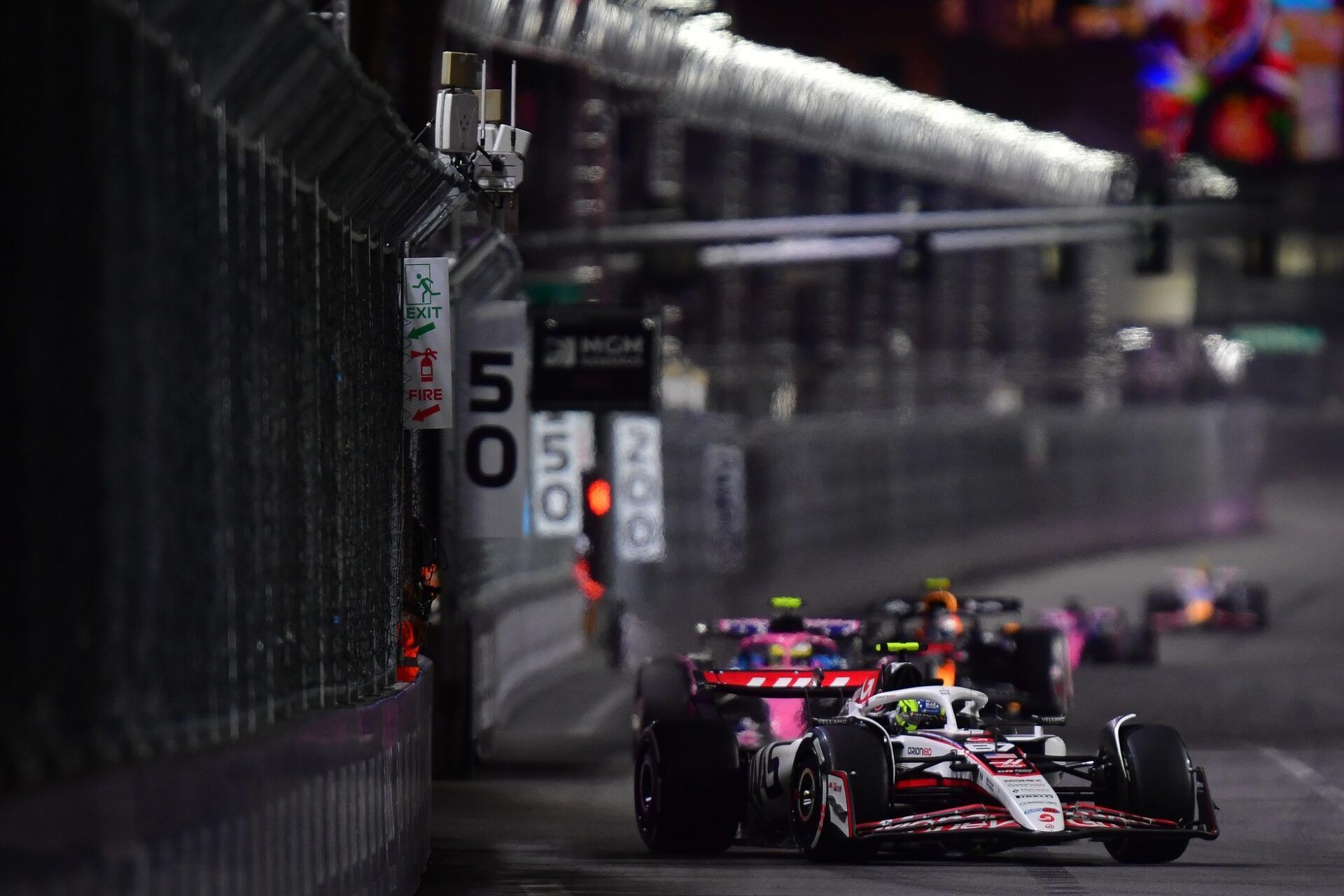 Haas F1 Team driver Oliver Bearman (87) leads a group during the Las Vegas Grand Prix at Las Vegas Strip Circuit.