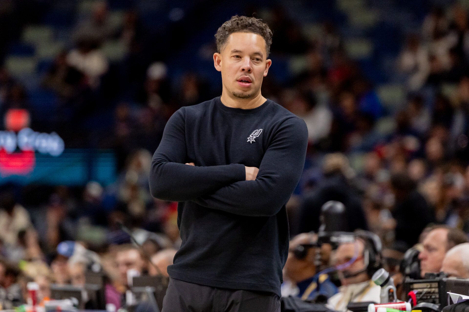 San Antonio Spurs Head Coach Mitch Johnson looks on against the New Orleans Pelicans during the first half at Smoothie King Center.