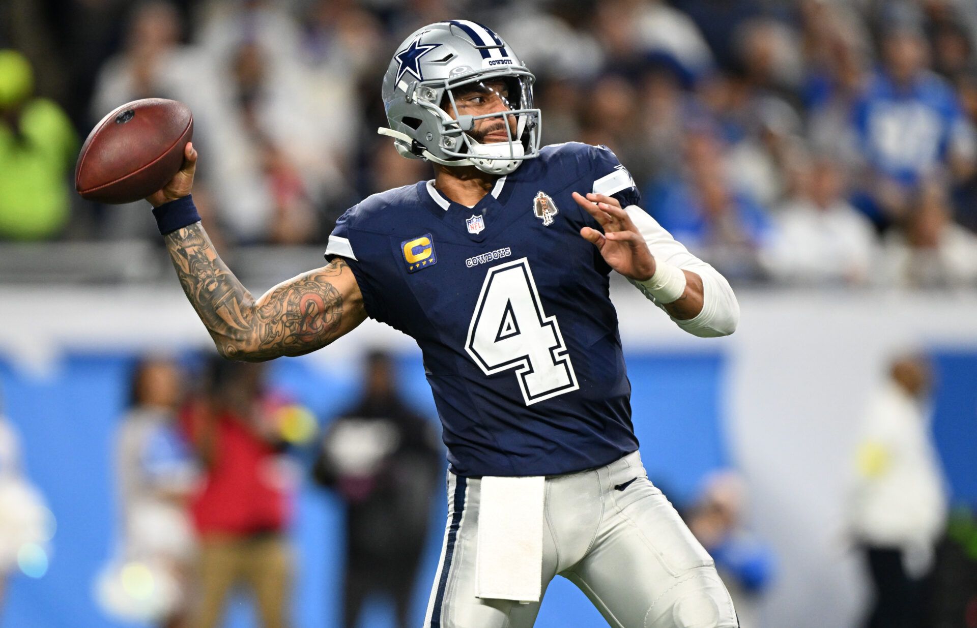 Dallas Cowboys quarterback Dak Prescott (4) throws during the first half against the Detroit Lions at Ford Field.