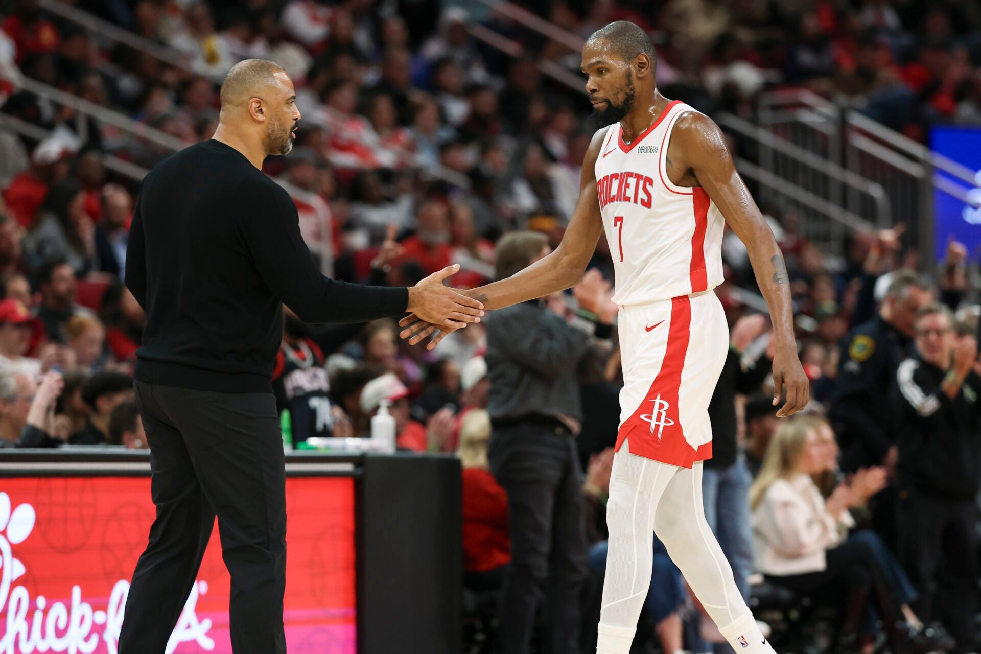 Houston Rockets forward Kevin Durant (7) shakes hands with head coach Ime Udoka during the third quarter against the Phoenix Suns at Toyota Center.