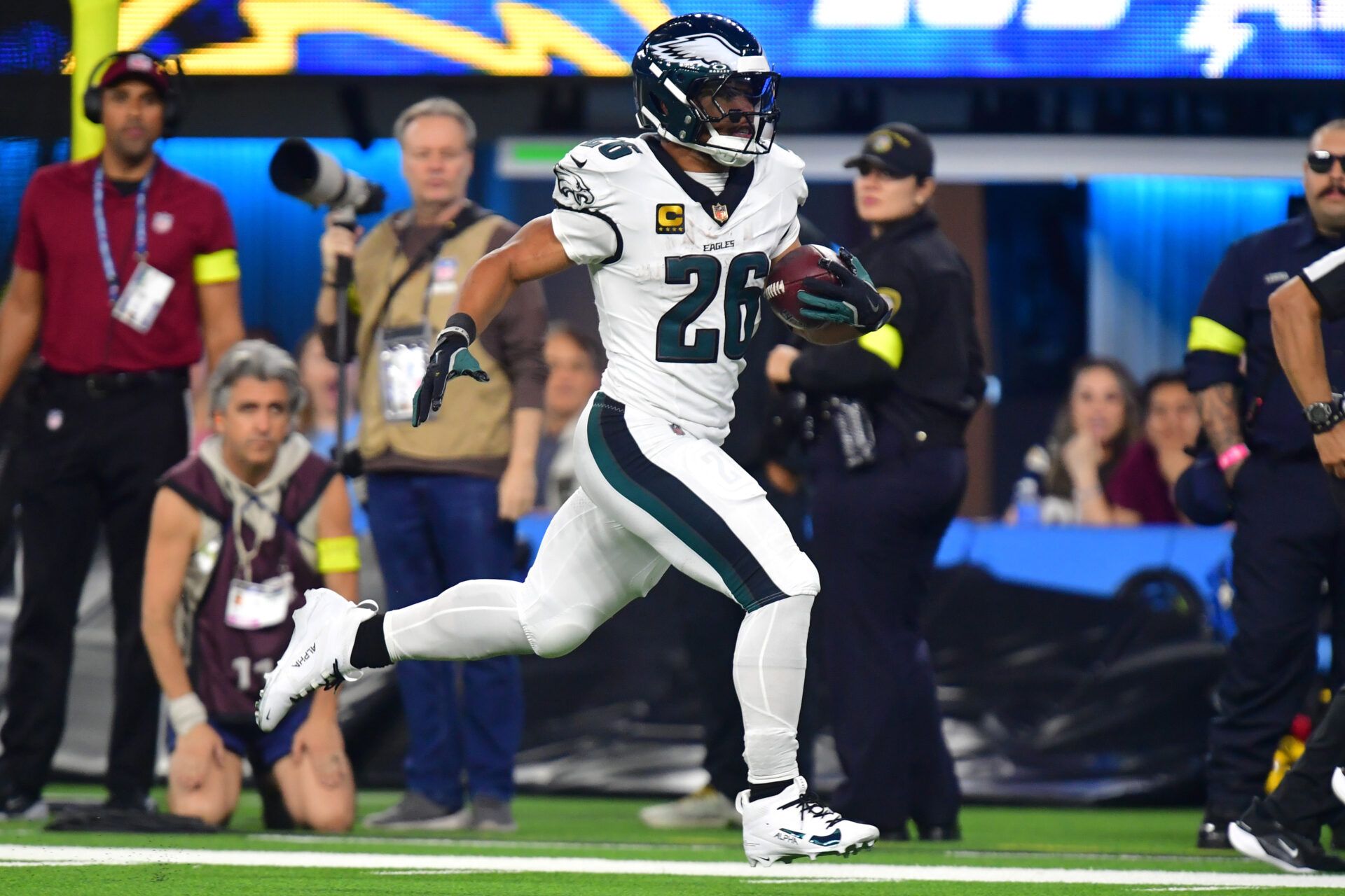 Philadelphia Eagles running back Saquon Barkley (26) runs for a touchdown against the Los Angeles Chargers in the second half at SoFi Stadium.