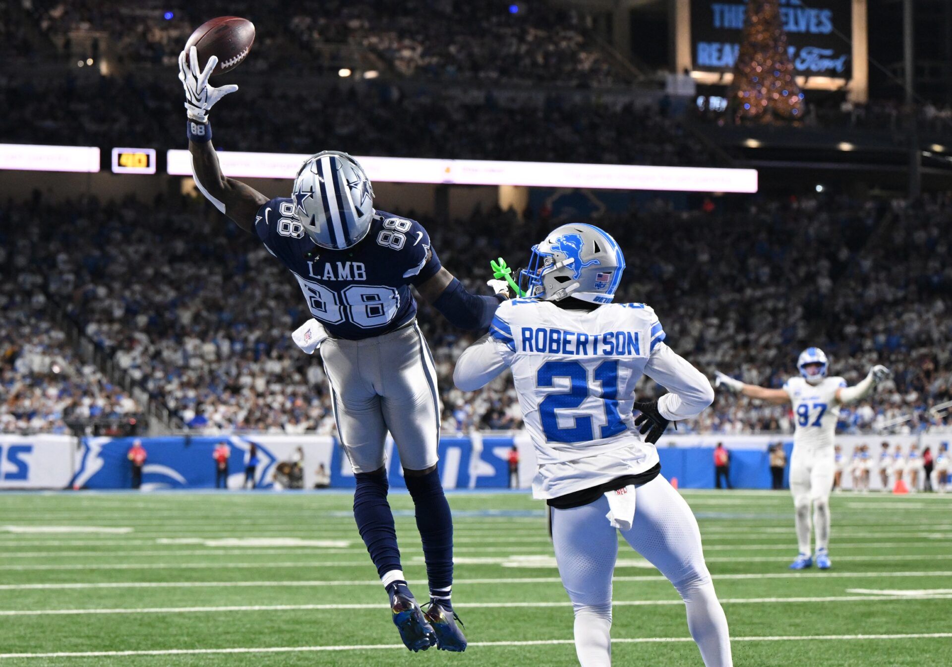 Dallas Cowboys wide receiver CeeDee Lamb (88) attempts to make a catch against Detroit Lions cornerback Amik Robertson (21) during the second half at Ford Field.