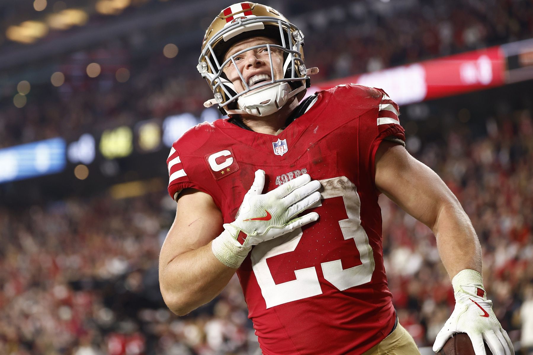 San Francisco 49ers running back Christian McCaffrey (23) reacts after scoring a touchdown against the Carolina Panthers during the second half at Levi's Stadium.