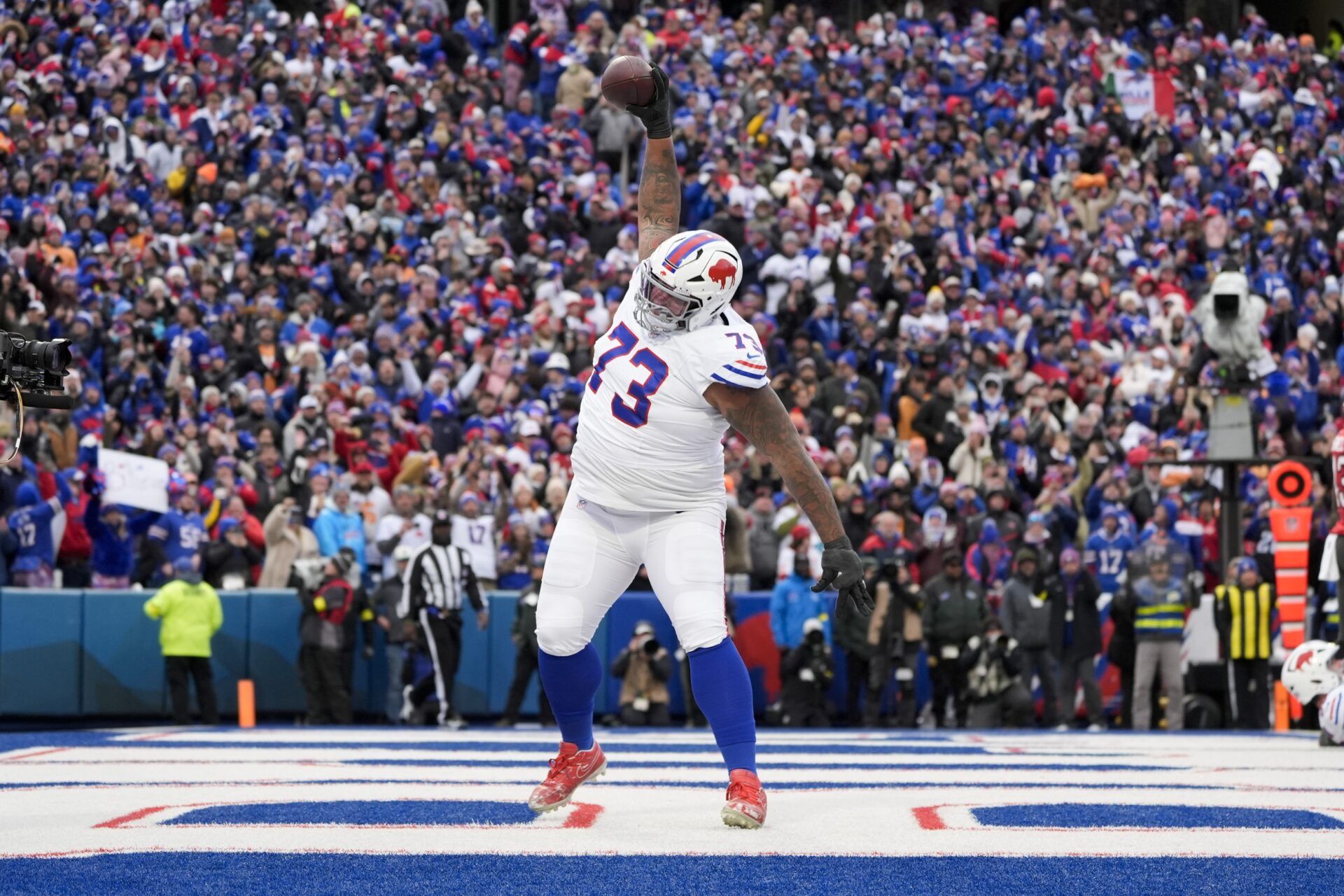 Buffalo Bills offensive tackle Dion Dawkins (73) celebrates Josh Allen’s first quarter touchdown against the Tampa Bay Buccaneers at Highmark Stadium.