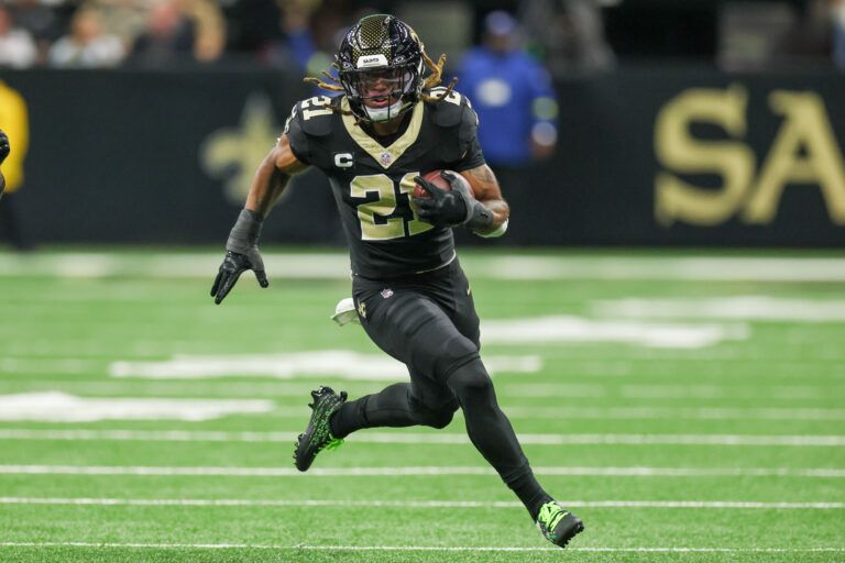 New Orleans Saints safety Justin Reid (21) carries the ball for a touchdown after making an interception against the Atlanta Falcons during the first half at Caesars Superdome.