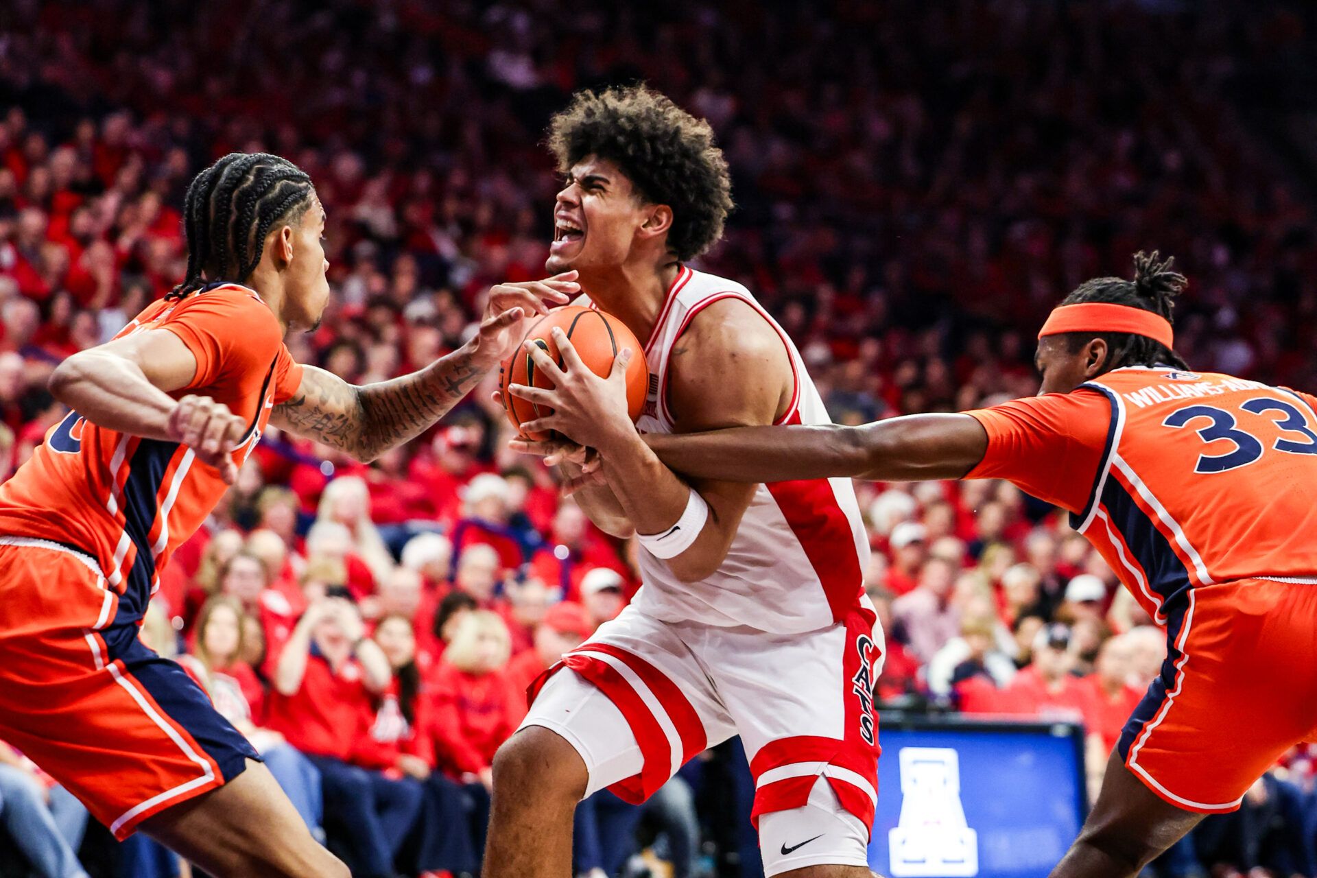 Auburn Tigers forward Sebastian Williams-Adams (33) fouls Arizona Wildcats forward Koa Peat (10) during the second half of the game at McKale Memorial Center.