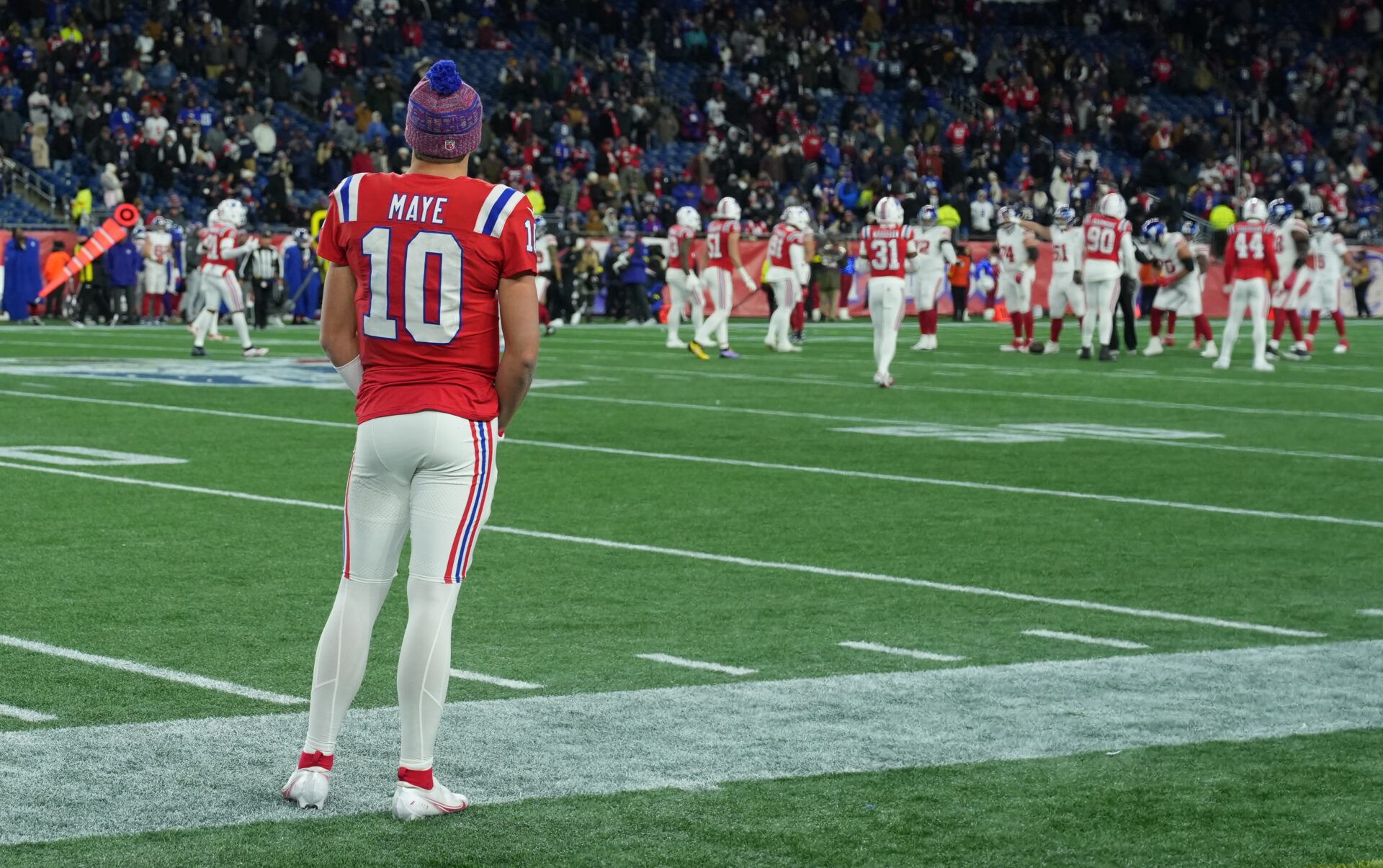 New England Patriots quarterback Drake Maye (10) watches from the sideline during the fourth quarter against the New York Giants at Gillette Stadium.
