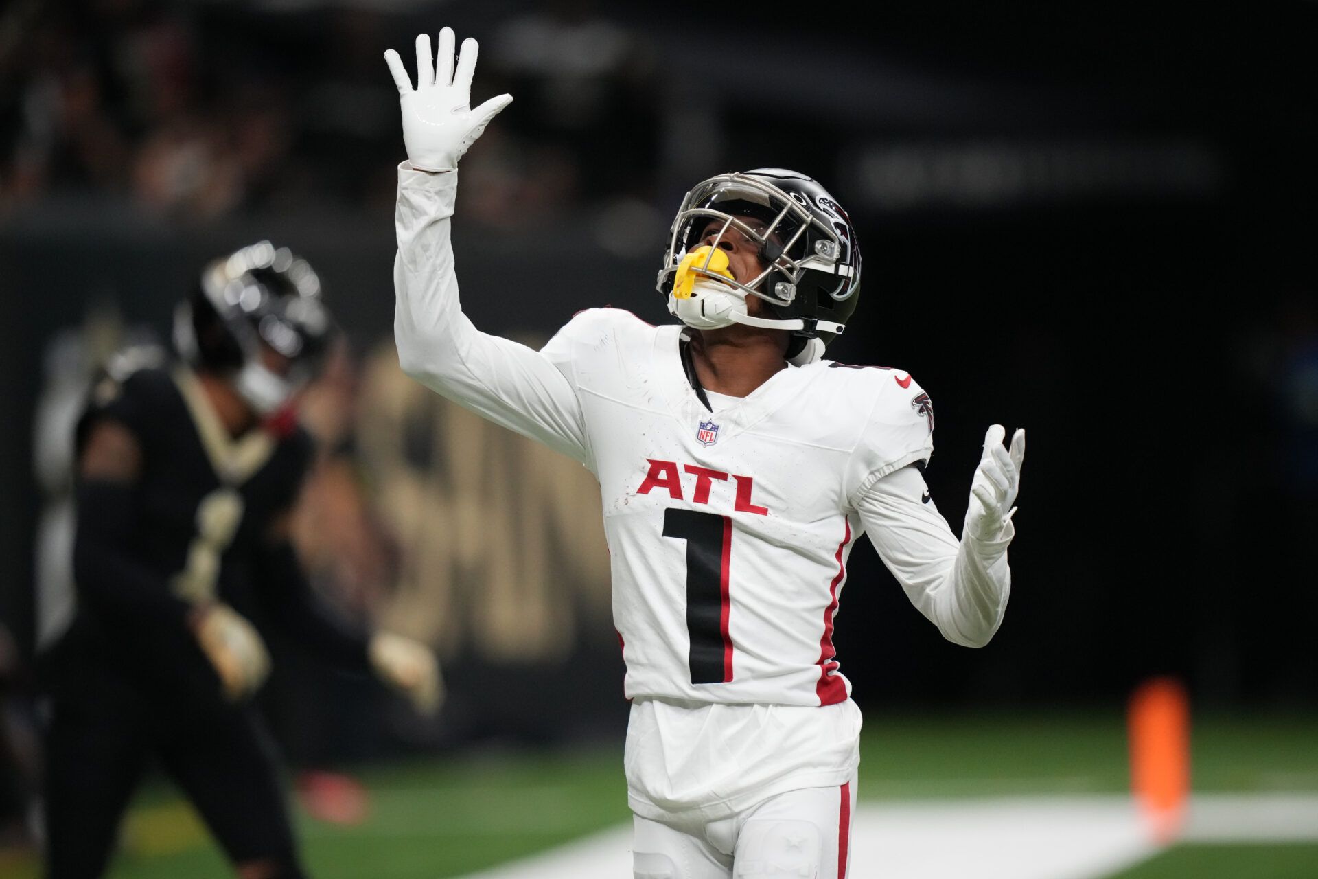 Atlanta Falcons wide receiver Darnell Mooney (1) reacts after catching a touchdown against the New Orleans Saints during the second half at Caesars Superdome.