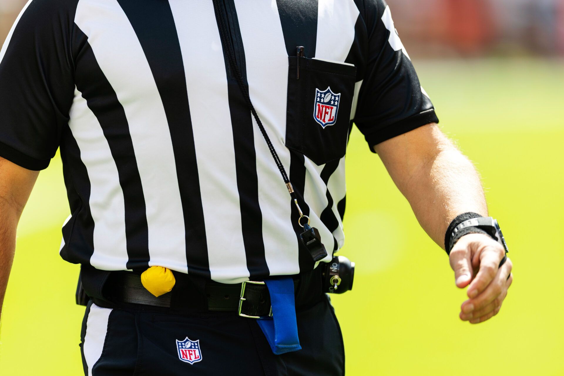 NFL referee penalty flag, uniform and whistle during the game between the Cleveland Browns and the Green Bay Packers at Huntington Bank Field.
