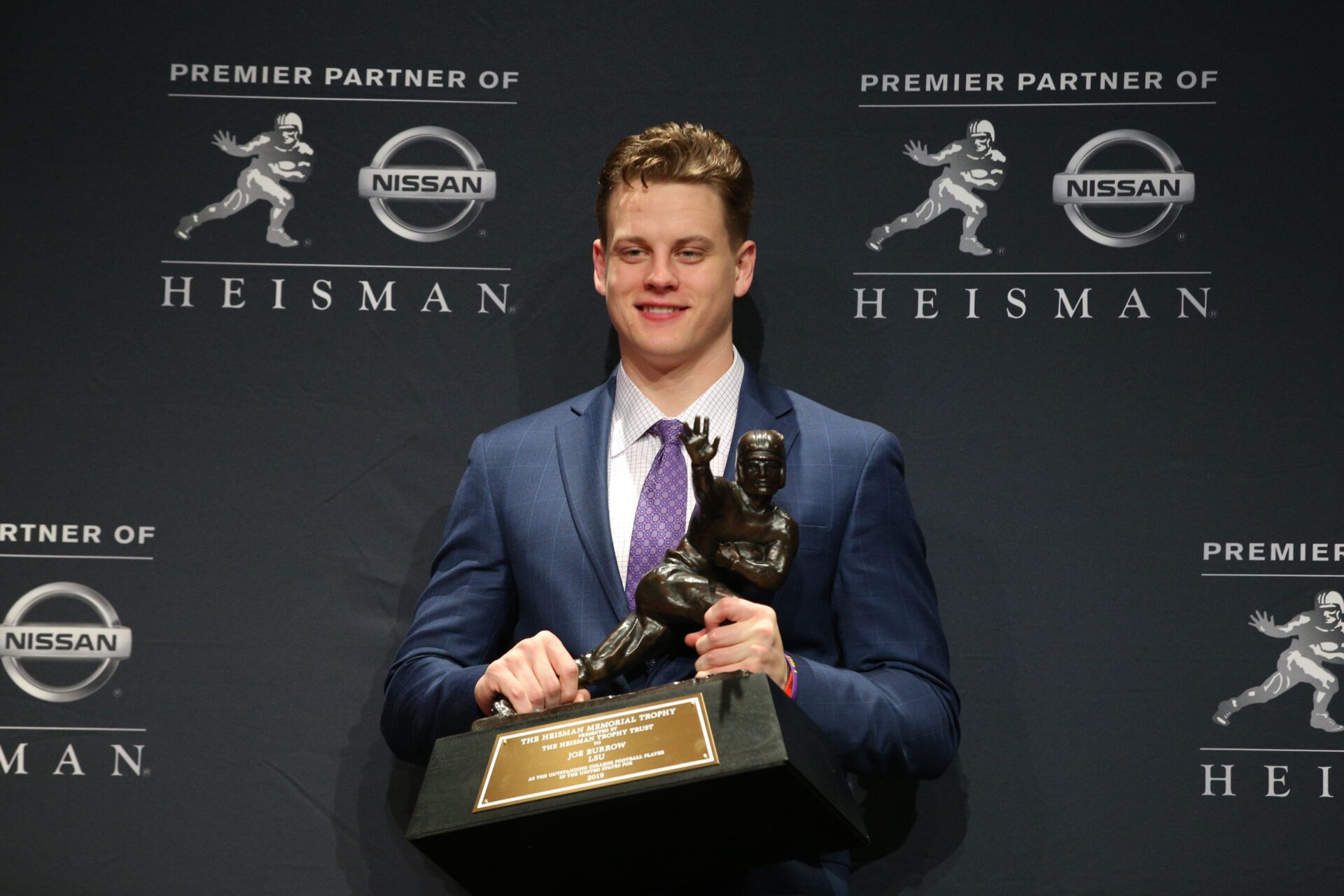 LSU Tigers quarterback and Heisman Trophy winner Joe Burrow poses with the trophy during a post ceremony press conference at the New York Marriott Marquis.