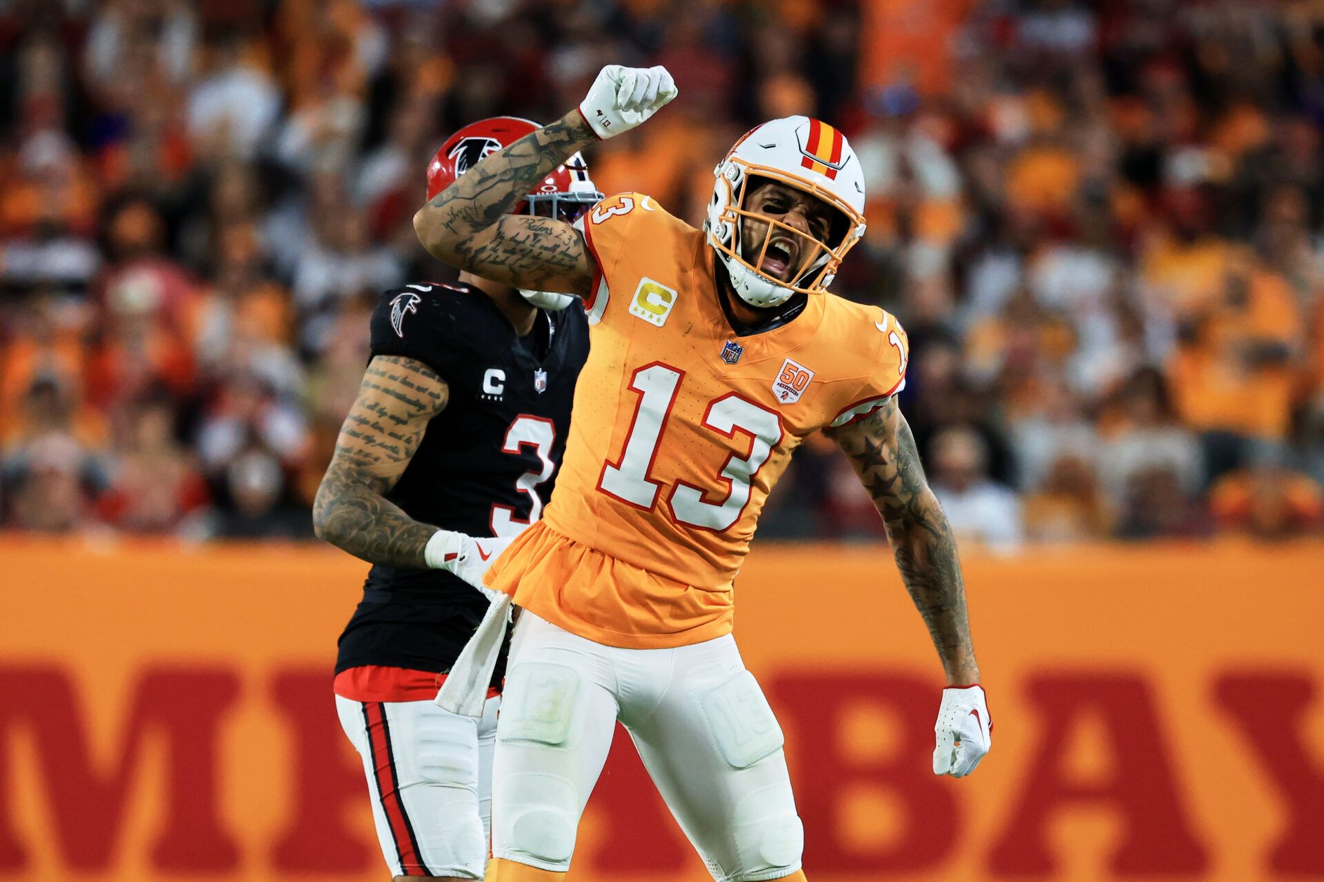 Tampa Bay Buccaneers wide receiver Mike Evans (13) reacts after catching a pass against Atlanta Falcons safety Jessie Bates III (3) (obscured) during the third quarter at Raymond James Stadium.