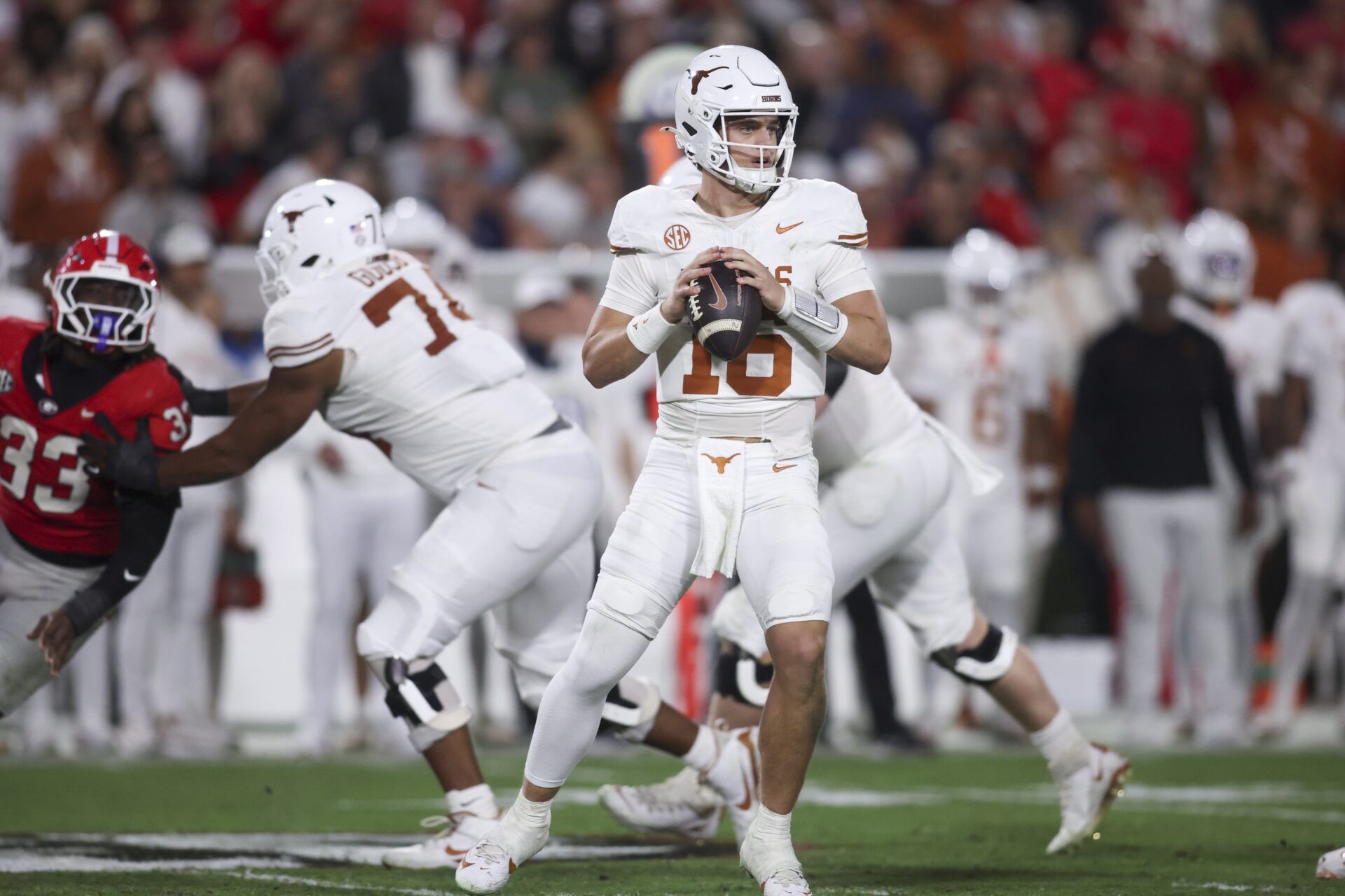 Texas Longhorns quarterback Arch Manning (16) looks to make a pass in the second half against the Georgia Bulldogs at Sanford Stadium.