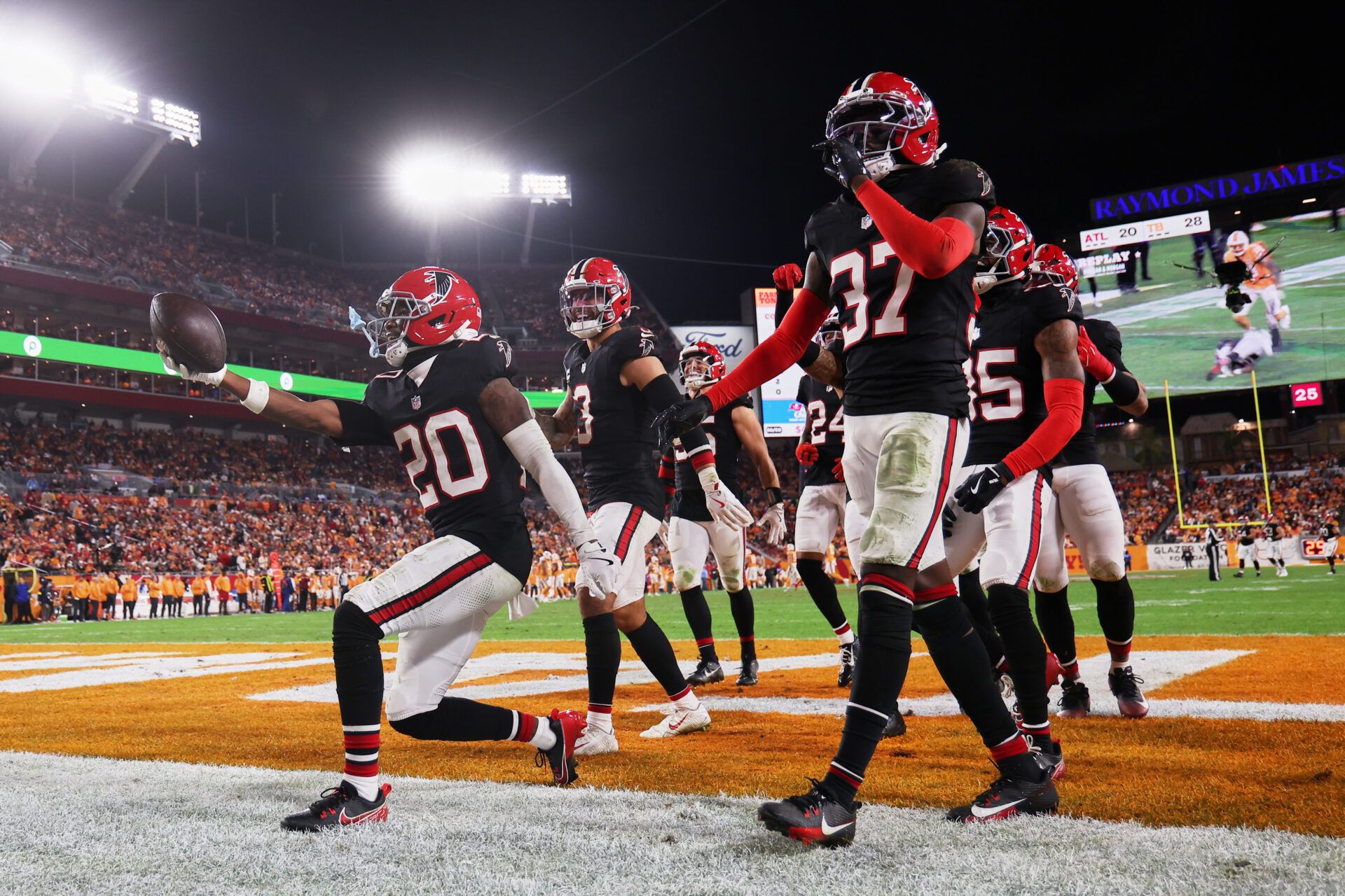 Atlanta Falcons cornerback Dee Alford (20) celebrates with safety Jessie Bates III (3) and cornerback Cobee Bryant (37) after intercepting a pass intended for Tampa Bay Buccaneers wide receiver Mike Evans (not pictured) during the fourth quarter at Raymond James Stadium.
