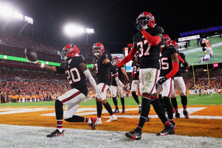 Atlanta Falcons cornerback Dee Alford (20) celebrates with safety Jessie Bates III (3) and cornerback Cobee Bryant (37) after intercepting a pass intended for Tampa Bay Buccaneers wide receiver Mike Evans (not pictured) during the fourth quarter at Raymond James Stadium.