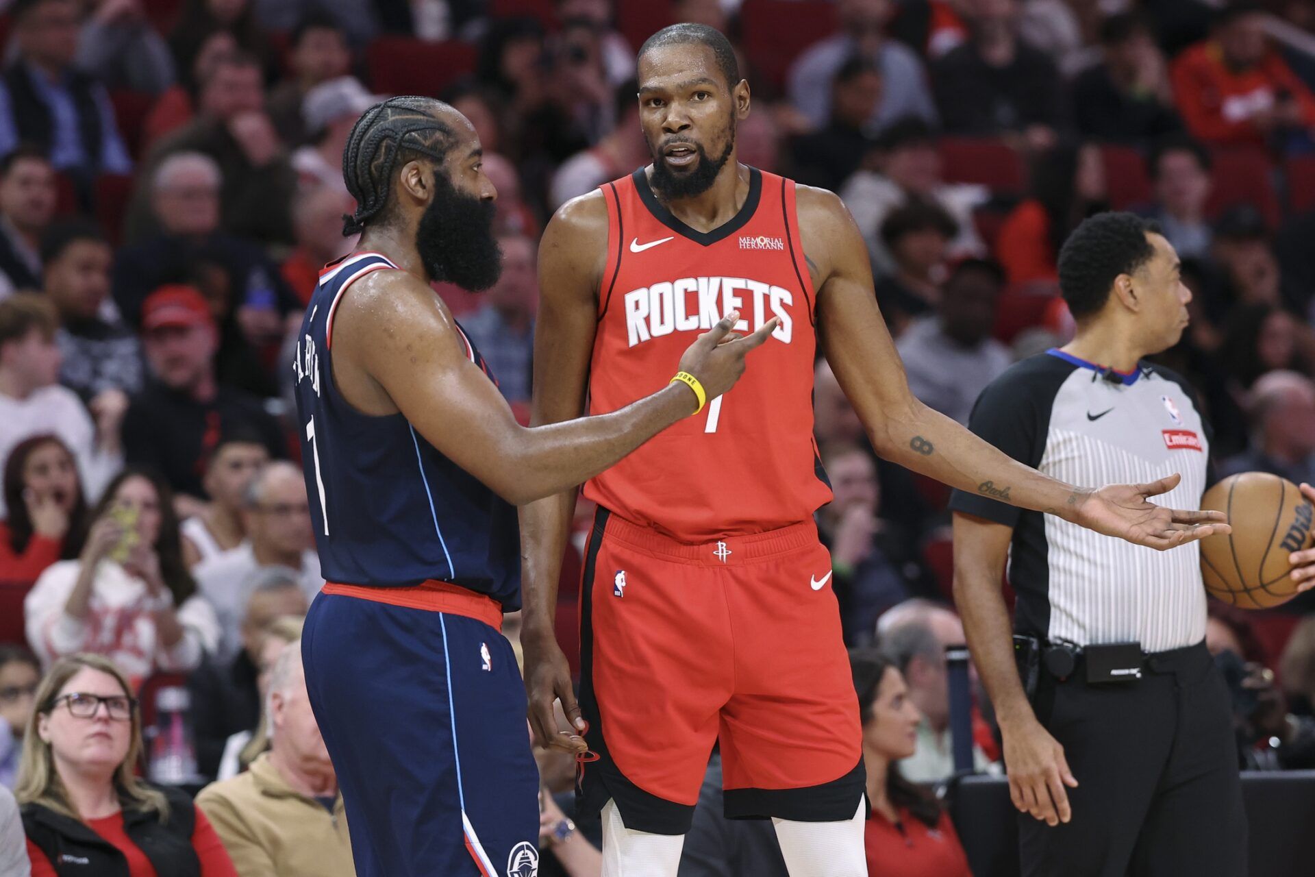 Houston Rockets forward Kevin Durant (7) talks with Los Angeles Clippers guard James Harden (1) during the third quarter at Toyota Center.