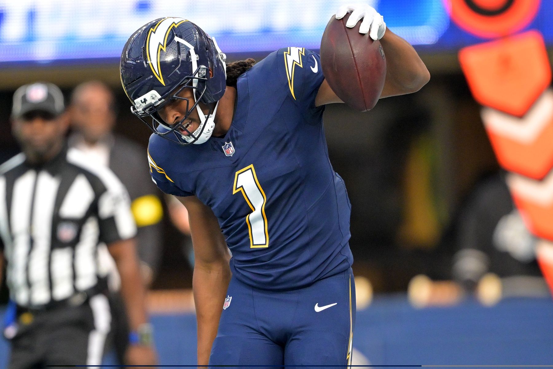 Los Angeles Chargers wide receiver Quentin Johnston (1) reacts after scoring a touchdown against the Las Vegas Raiders during the first half at SoFi Stadium.