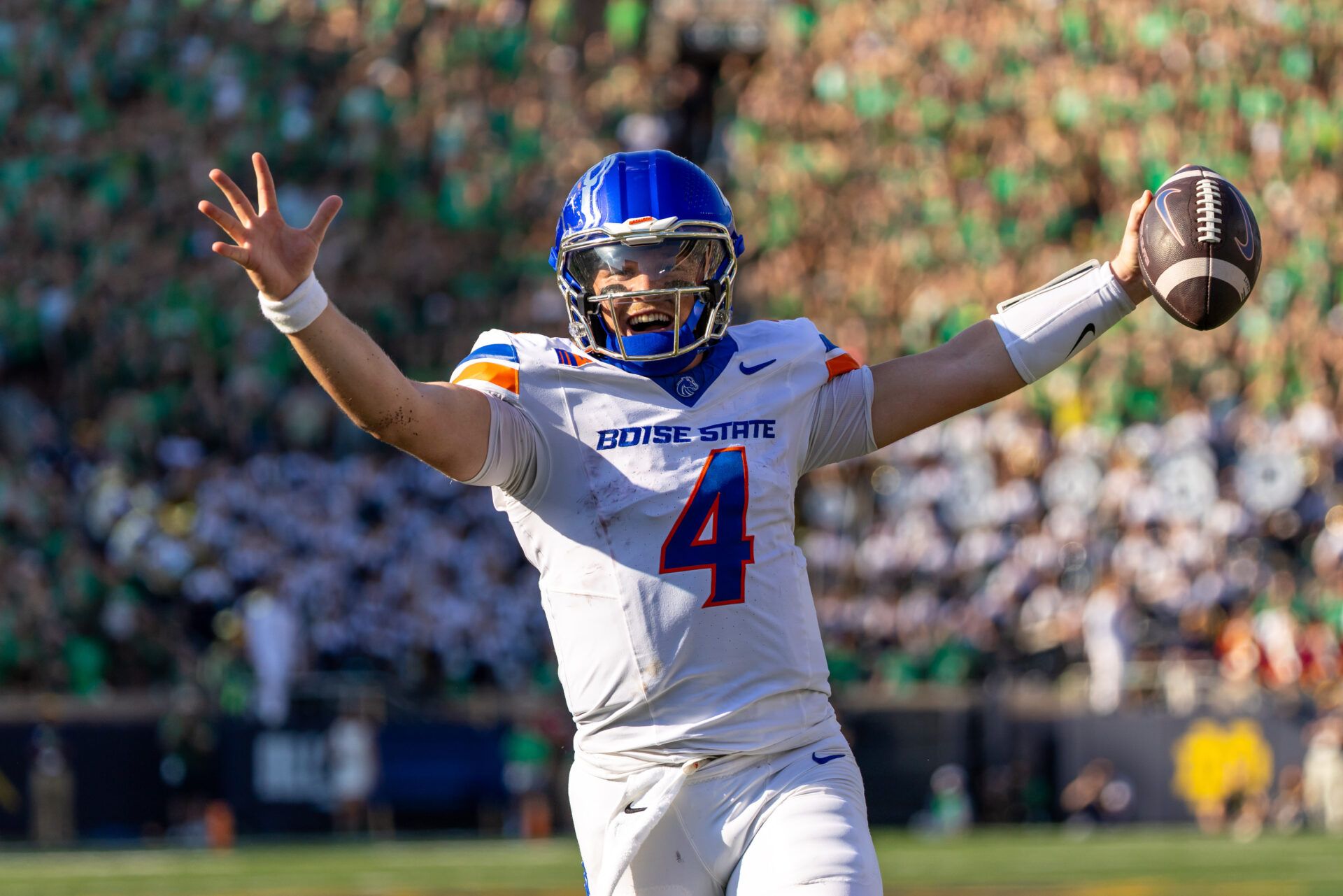 Boise State Broncos quarterback Maddux Madsen (4) celebrates as he runs in a touchdown against the Notre Dame Fighting Irish during the first half at Notre Dame Stadium.