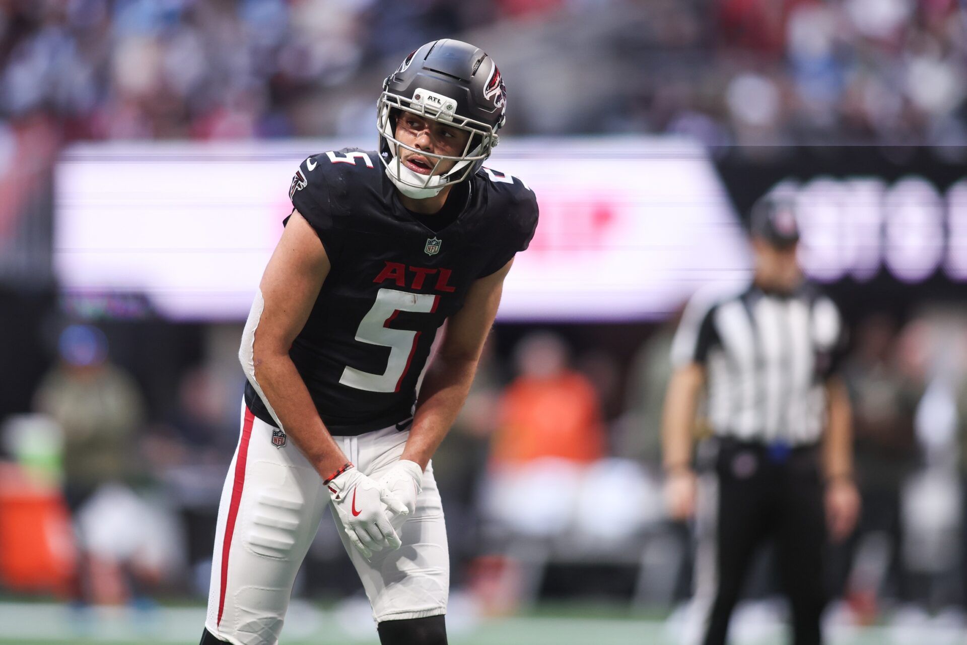 Atlanta Falcons wide receiver Drake London (5) looks on before the start of a play against the Carolina Panthers in the second quarter at Mercedes-Benz Stadium.