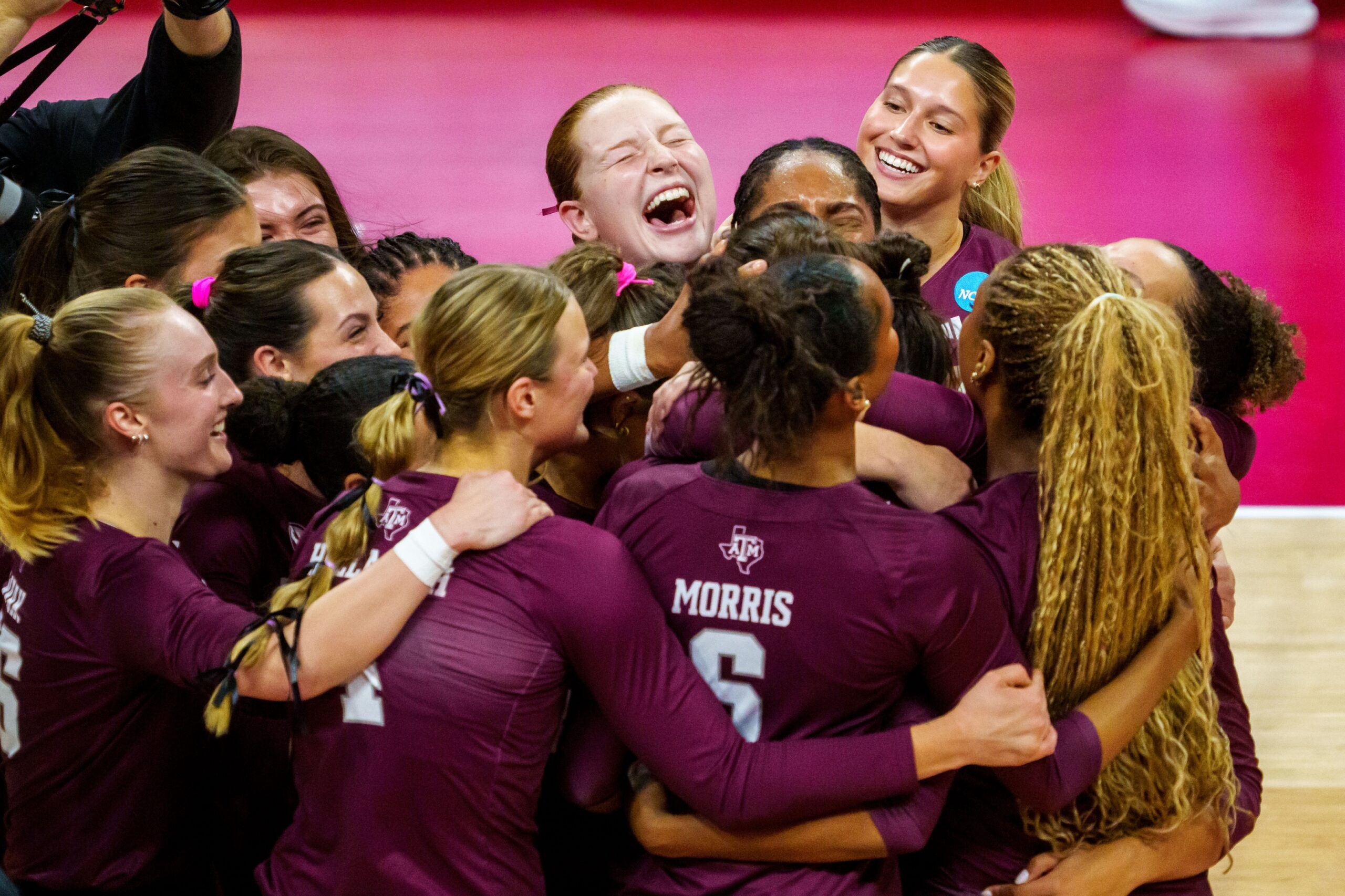 The Texas A&M Aggies celebrate after defeating the Louisville Cardinals at Bob Devaney Sports Center.