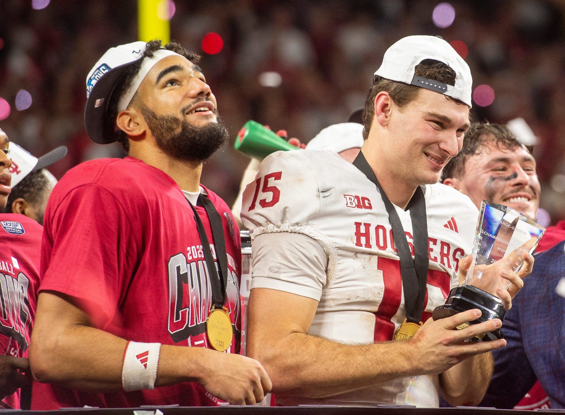 Indiana's Fernando Mendoza (15) holds the MVP trophy next to Elijah Sarratt after the Indiana versus Ohio State Big Ten Championship football game at Lucas Oil Stadium on Saturday, Dec. 6, 2025.