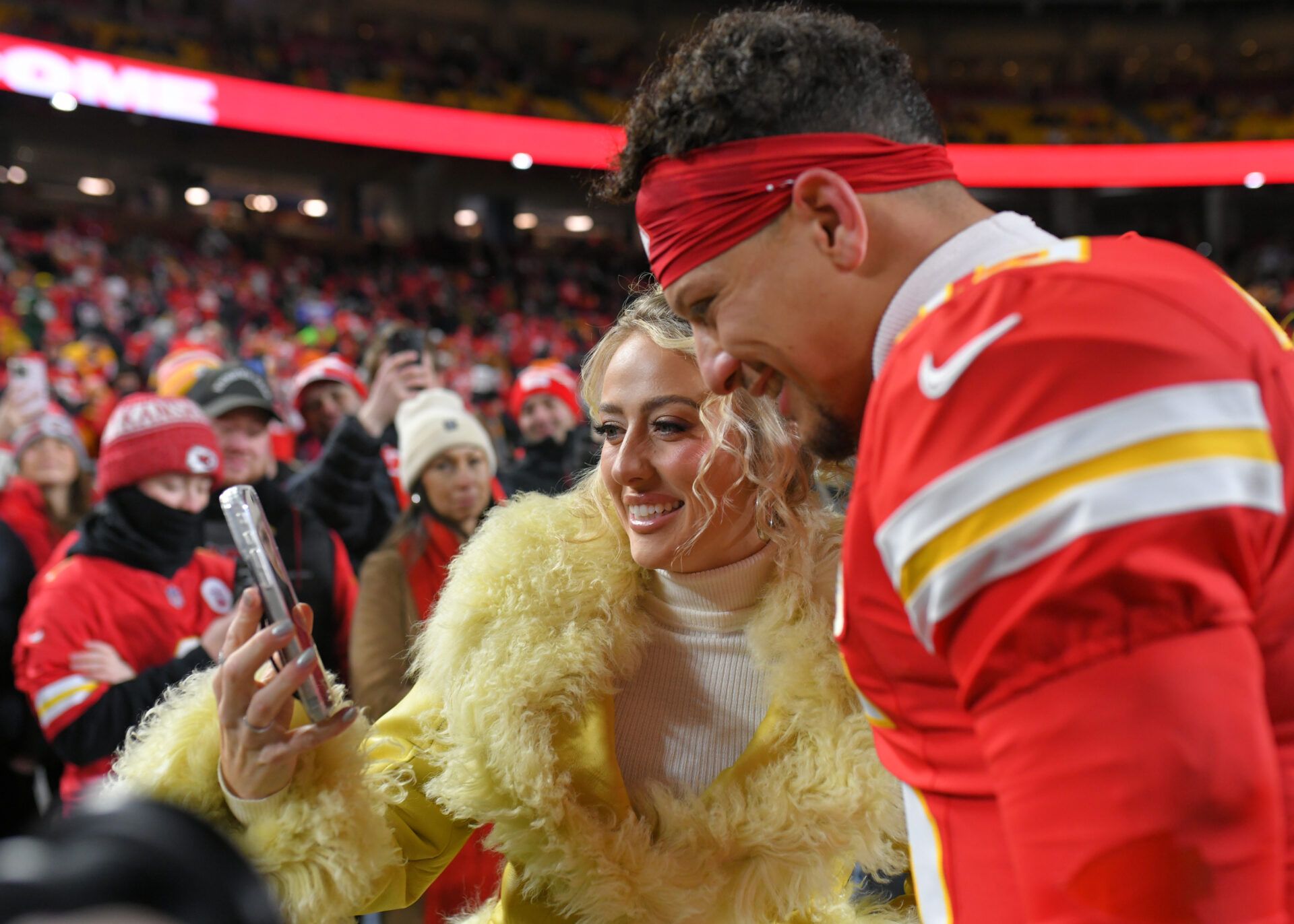 Brittany Mahomes and Kansas City Chiefs quarterback Patrick Mahomes (15) take a picture prior to the game against the Houston Texans at GEHA Field at Arrowhead Stadium.