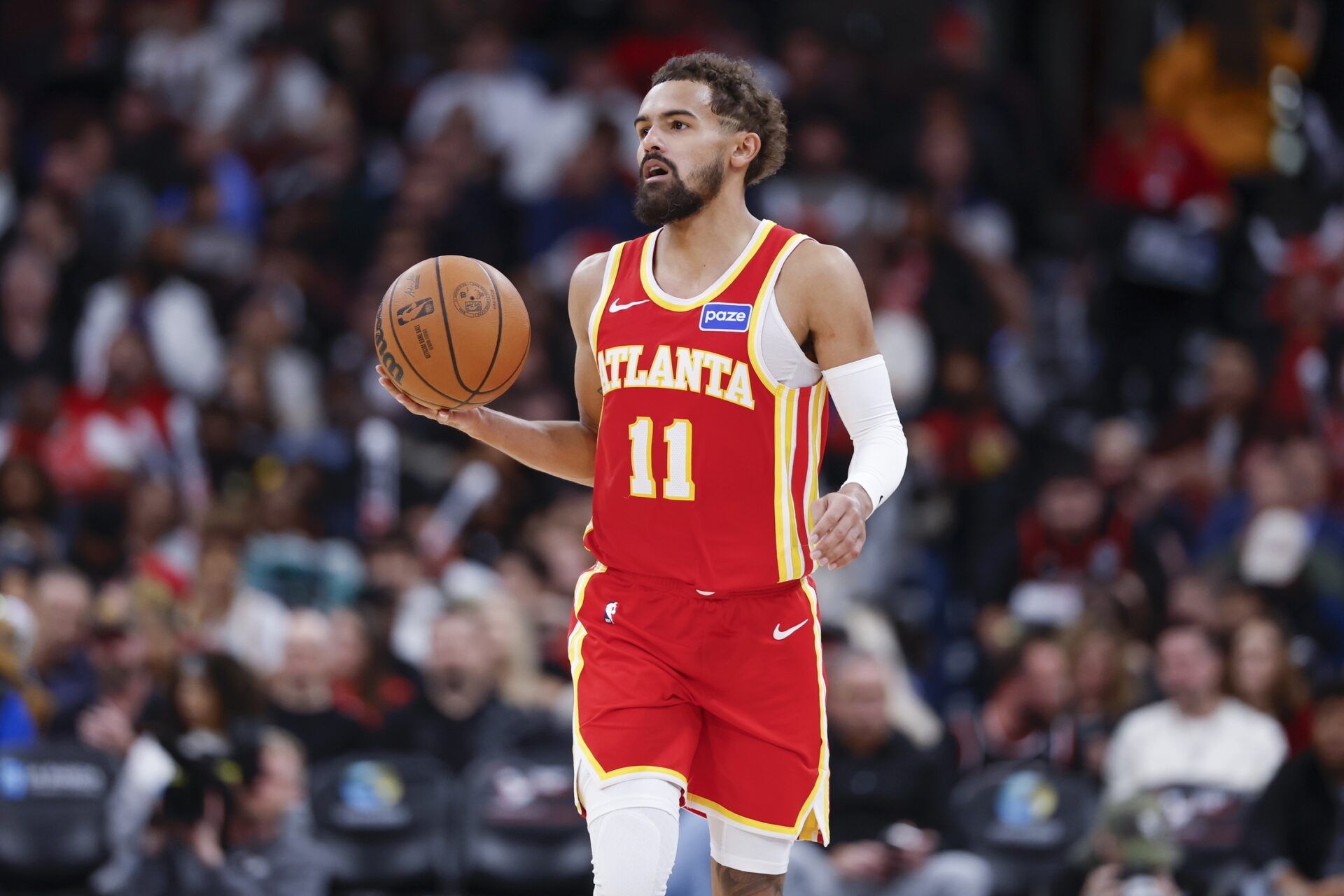 Atlanta Hawks guard Trae Young (11) brings the ball up court against the Chicago Bulls during the second half at United Center.