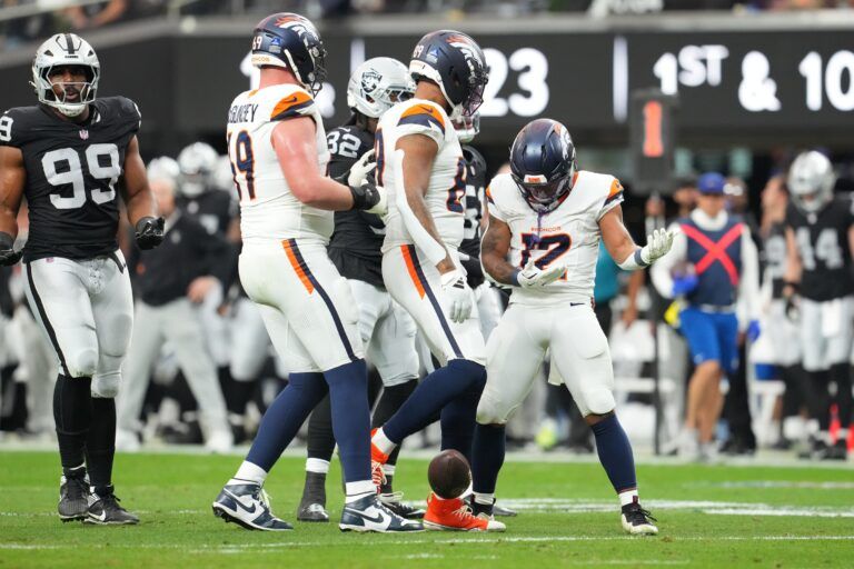 Denver Broncos running back RJ Harvey (12) reacts after carrying the ball for a first down against the Las Vegas Raiders during the first half at Allegiant Stadium.
