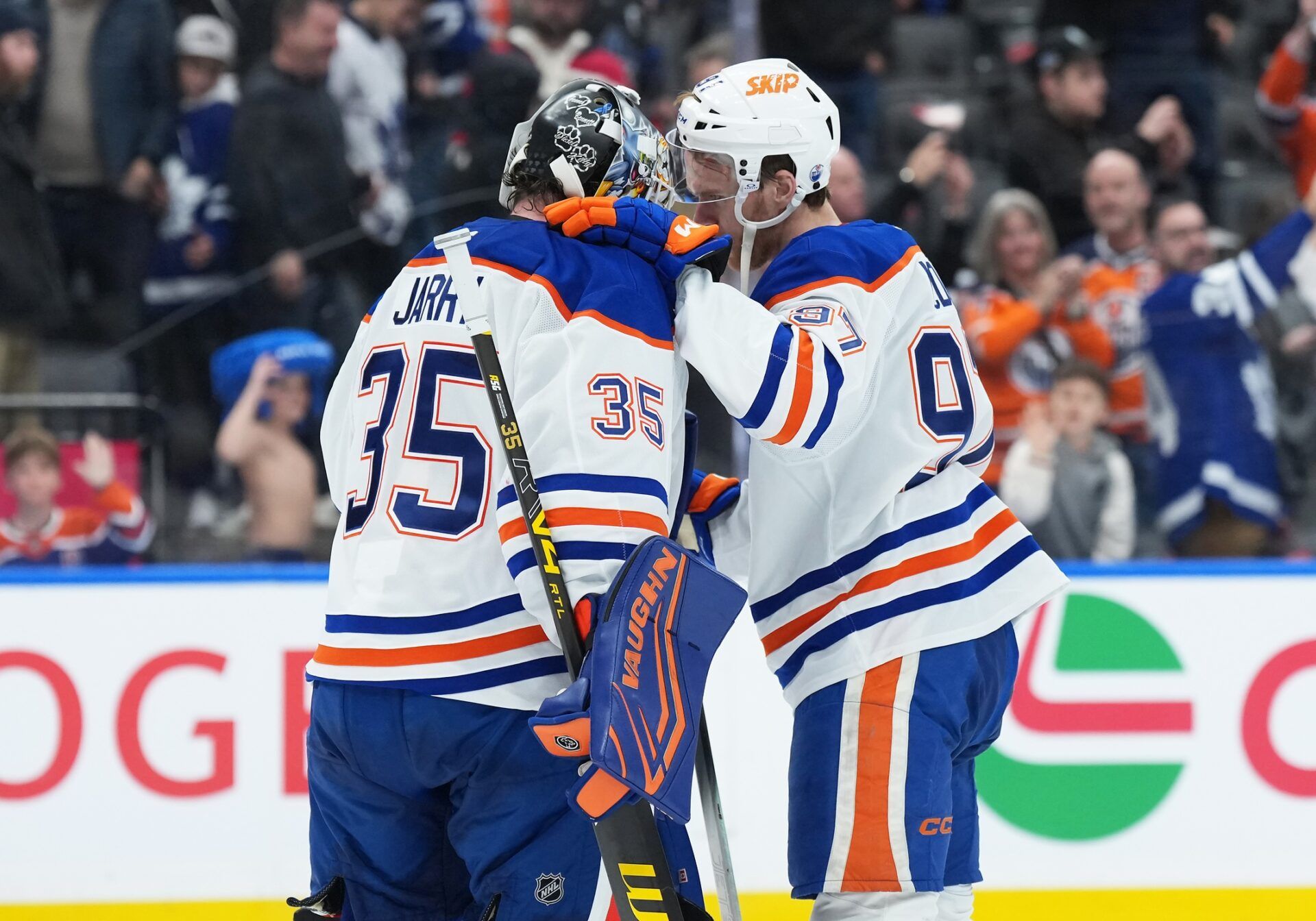Edmonton Oilers center Connor McDavid (97) celebrates the win with goaltender Tristan Jarry (35) against the Toronto Maple Leafs at the end of the third period at Scotiabank Arena.