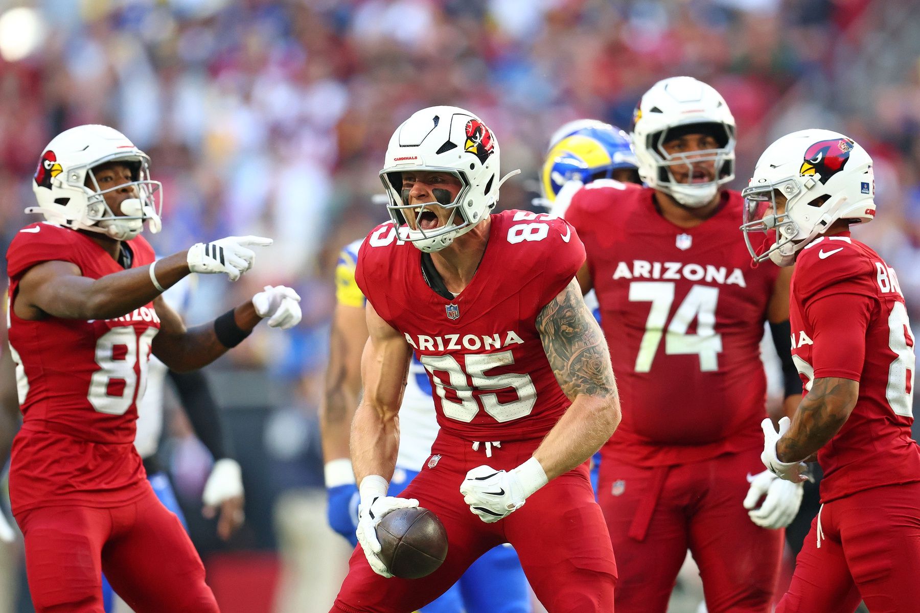 Arizona Cardinals tight end Trey McBride (85) reacts after a catch against the Los Angeles Rams during the first half at State Farm Stadium.