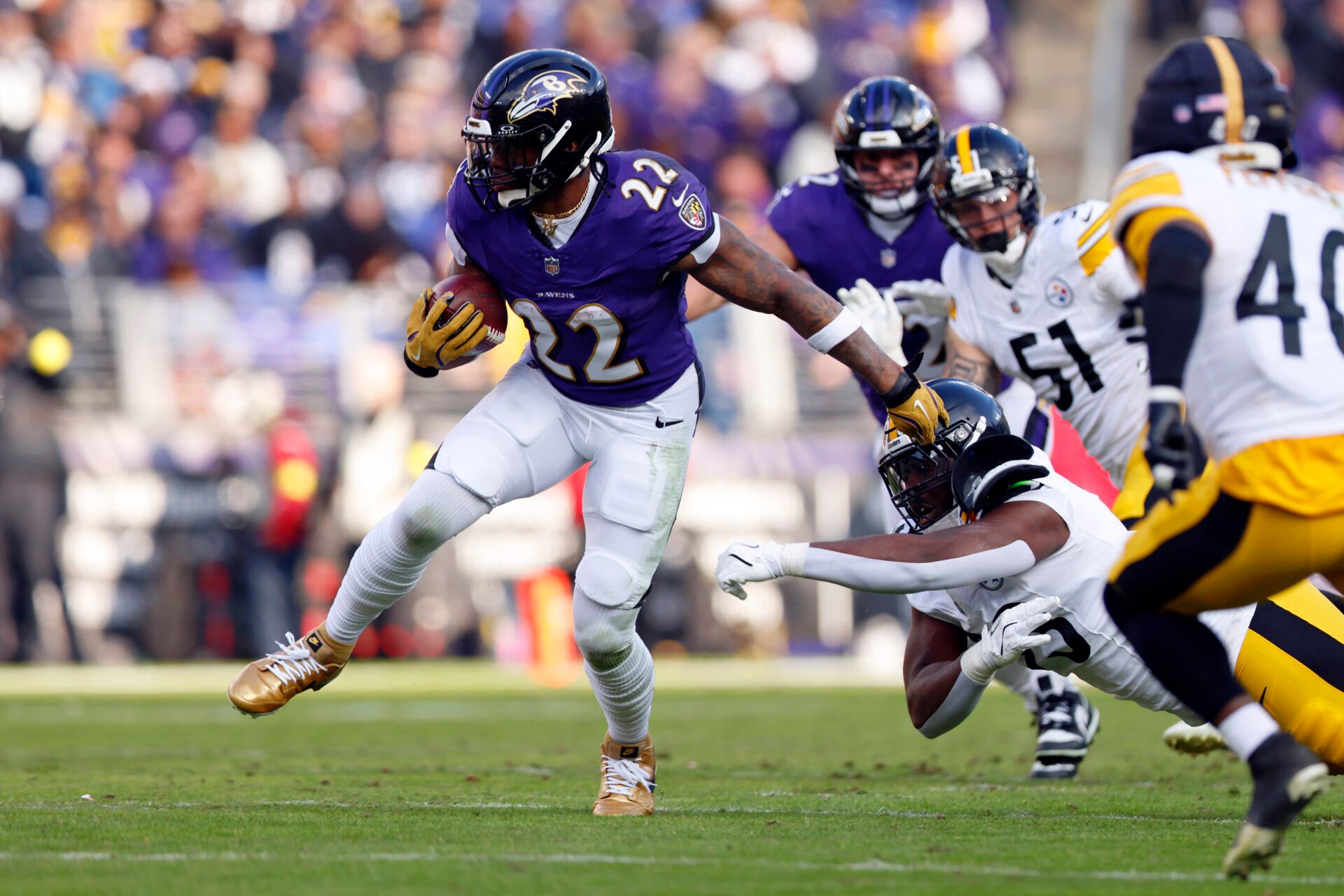 Baltimore Ravens running back Derrick Henry (22) runs with the ball against the Pittsburgh Steelers during the first half at M&T Bank Stadium.