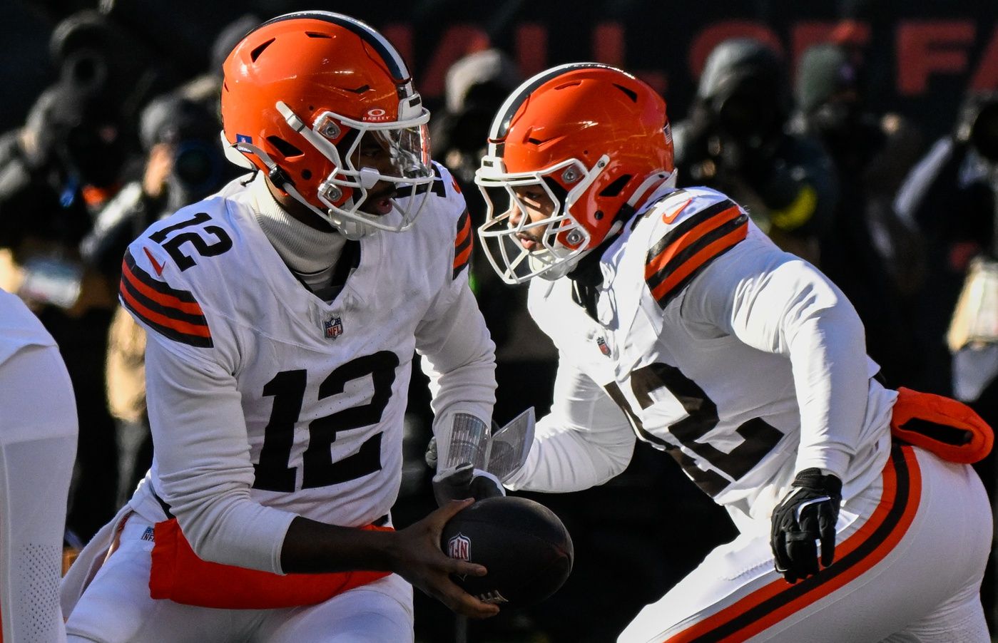 Cleveland Browns quarterback Shedeur Sanders (12) looks to hand the ball off during the first quarter against the Chicago Bears at Soldier Field.