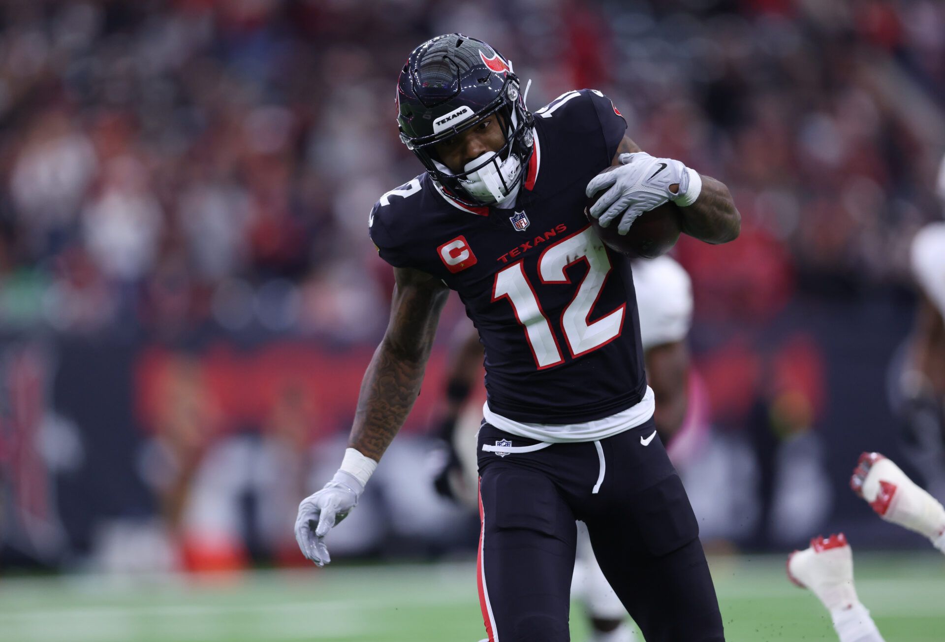 Houston Texans wide receiver Nico Collins (12) runs for a touchdown during the first quarter against the Arizona Cardinals at NRG Stadium.