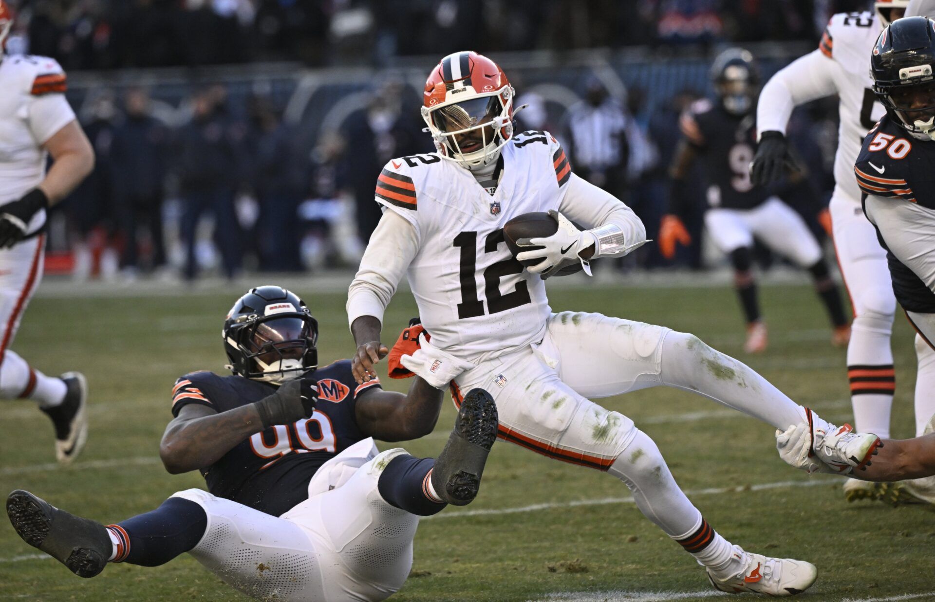 Chicago Bears defensive tackle Gervon Dexter Sr. (99) sacks Cleveland Browns quarterback Shedeur Sanders (12) during the fourth quarter at Soldier Field.