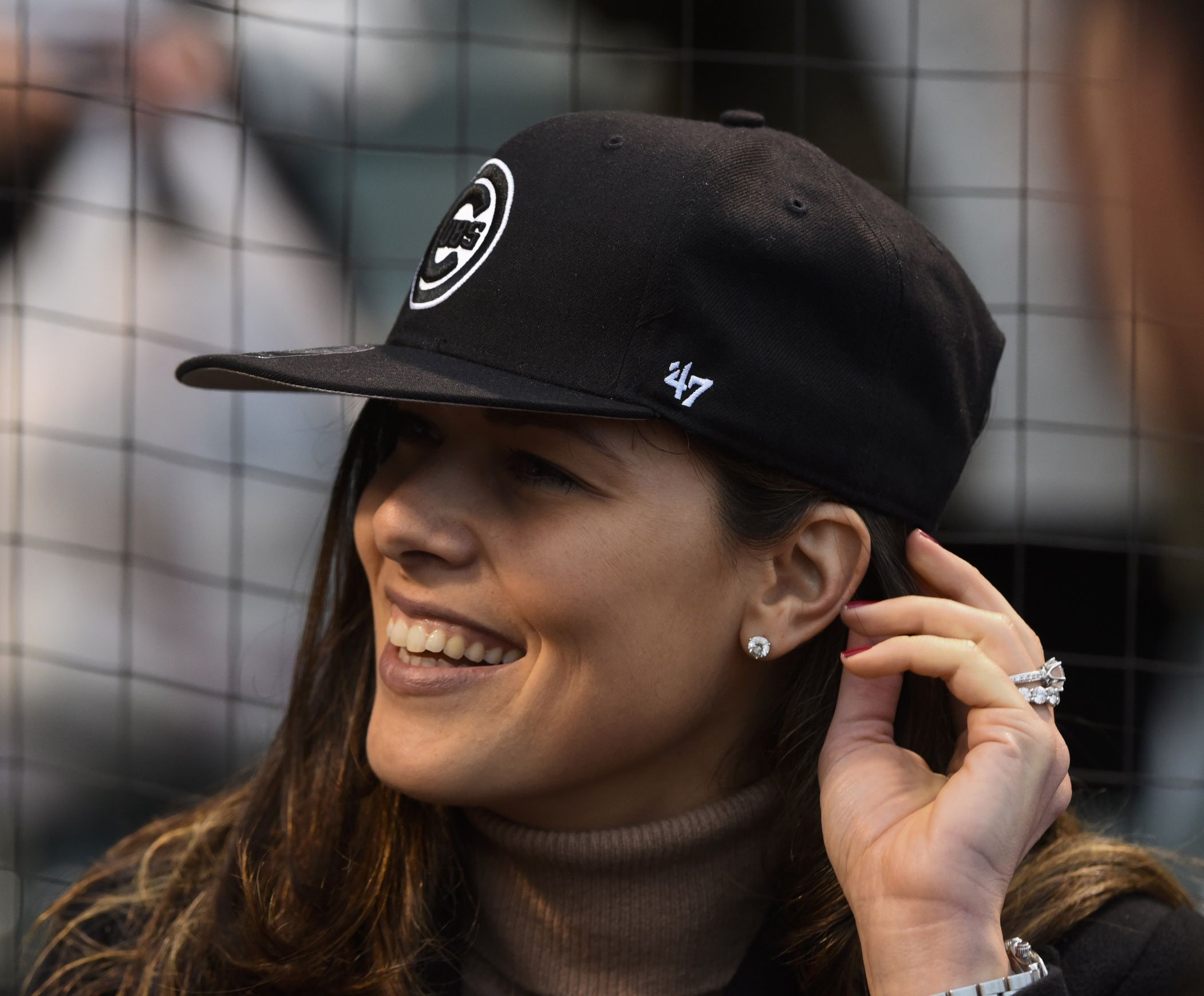 Ana Ivanovic, a retired French Open Tennis champion reacts before her husband Bastian Schweinsteiger threw out a ceremonial first pitch at Wrigley Field.