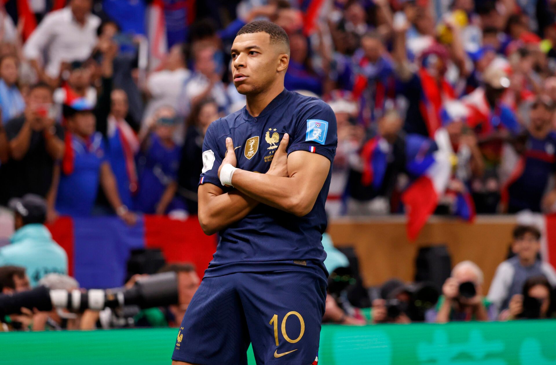 France forward Kylian Mbappe (10) celebrates after scoring a goal against Argentina on a penalty kick for his third goal of the match during extra time of the 2022 World Cup final at Lusail Stadium.