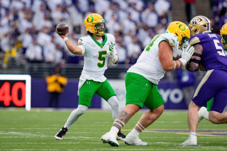 Oregon quarterback Dante Moore throws a pass as the Oregon Ducks take on the Washington Huskies on Nov. 29, 2025, at Husky Stadium in Seattle, Washington.