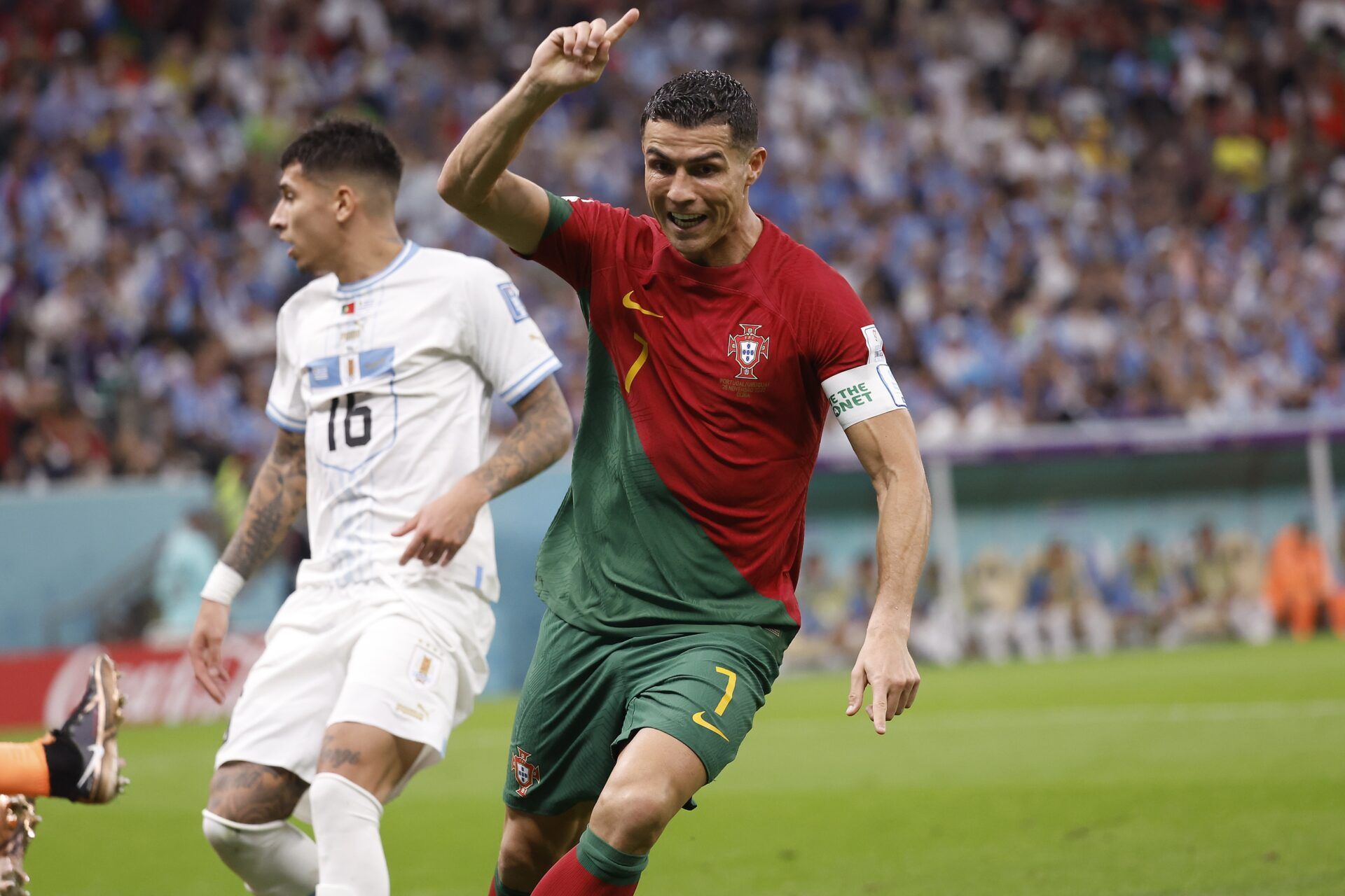 Portugal forward Cristiano Ronaldo (7) celebrates his goal scored against Uruguay during the second half of the group stage match in the 2022 World Cup at Lusail Stadium. The goal would instead be credited to midfielder Bruno Fernandes (8).