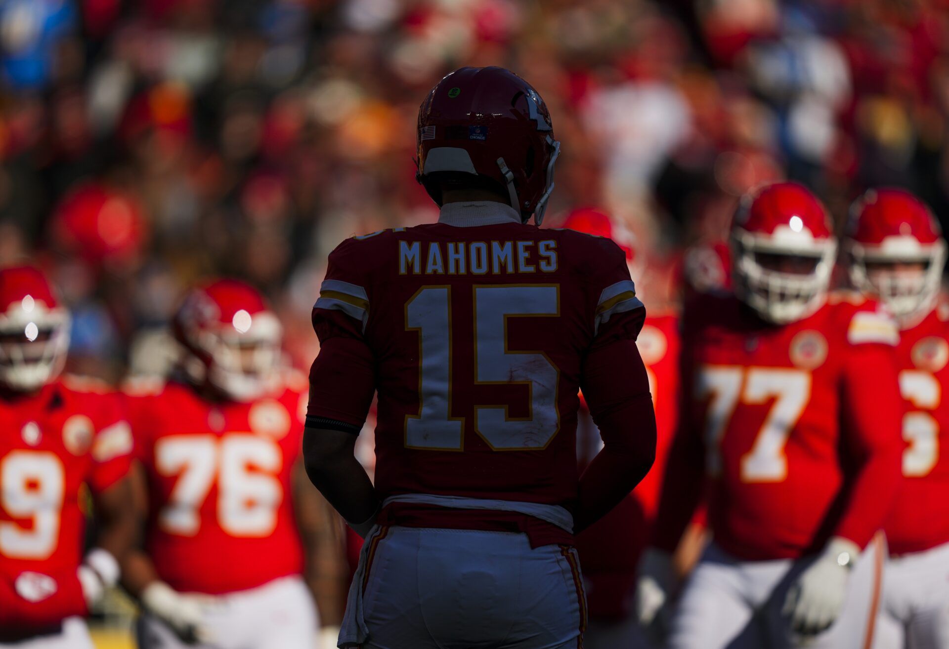 Kansas City Chiefs quarterback Patrick Mahomes (15) walks to the huddle from the sideline during the second quarter against the Los Angeles Chargers at GEHA Field at Arrowhead Stadium.